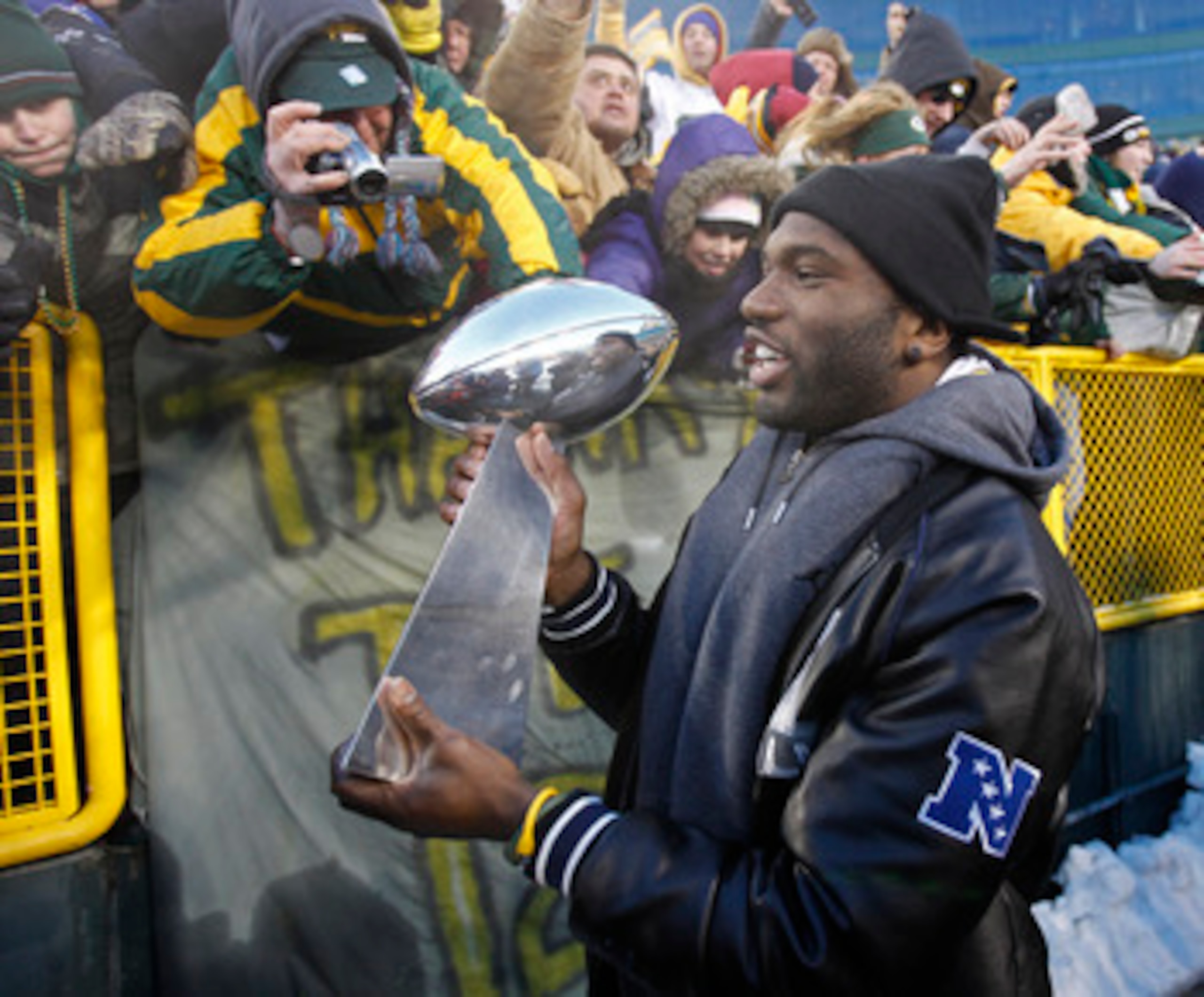 GREEN BAY, WI - FEBRUARY 08:  Green Bay Packers safety Nick Collins carries the Lombardi Trophy around Lambeau field during the Packers victory ceremony on February 8, 2011 in Green Bay, Wisconsin.  (Photo by Matt Ludtke/Getty Images)