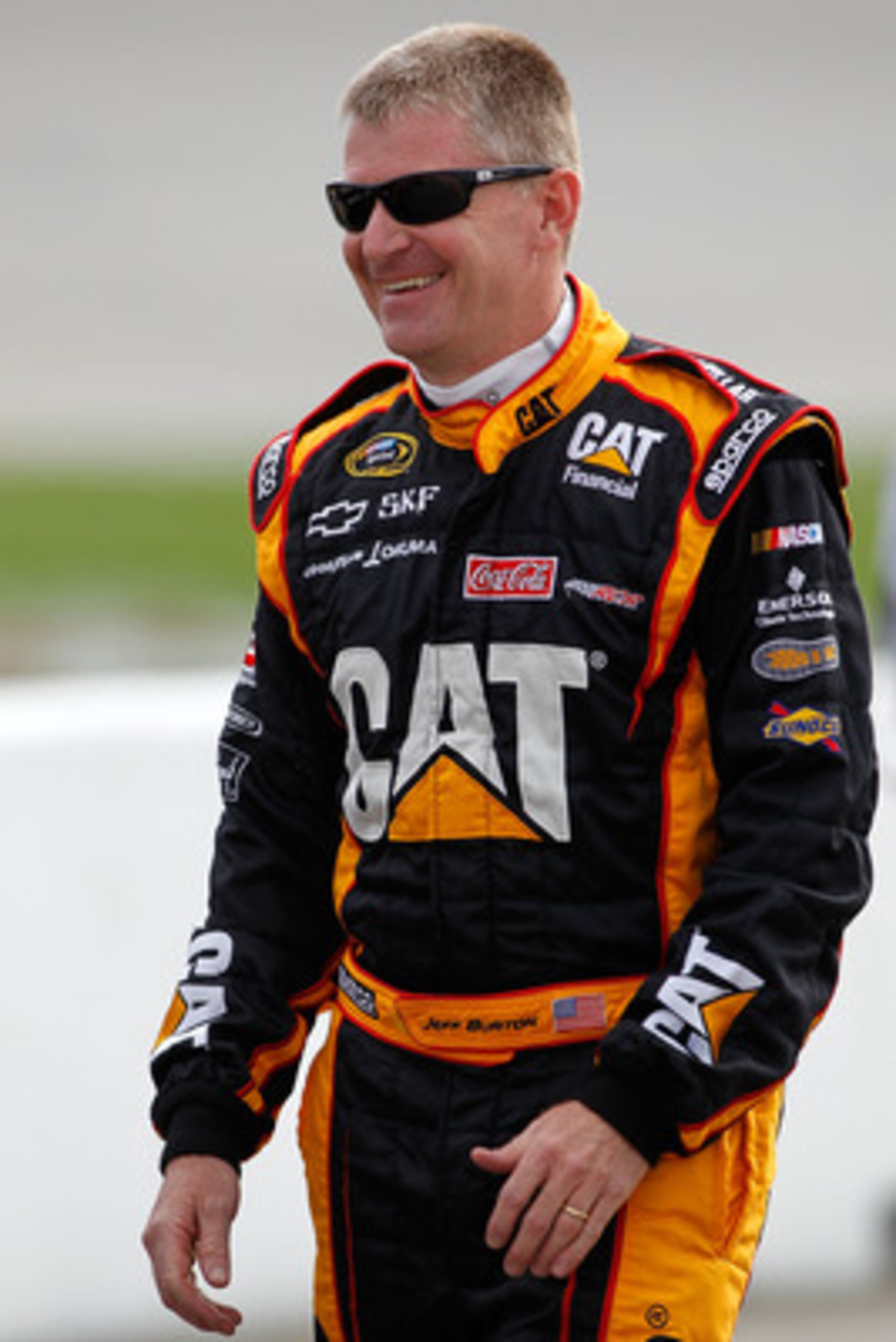 RICHMOND, VA - APRIL 29:  Jeff Burton, driver of the #31 Caterpillar Chevrolet, walks on pit road during qualifying for the NASCAR Sprint Cup Series Crown Royal Presents The Matthew & Daniel Hansen 400 at Richmond International Raceway on April 29, 2011 i