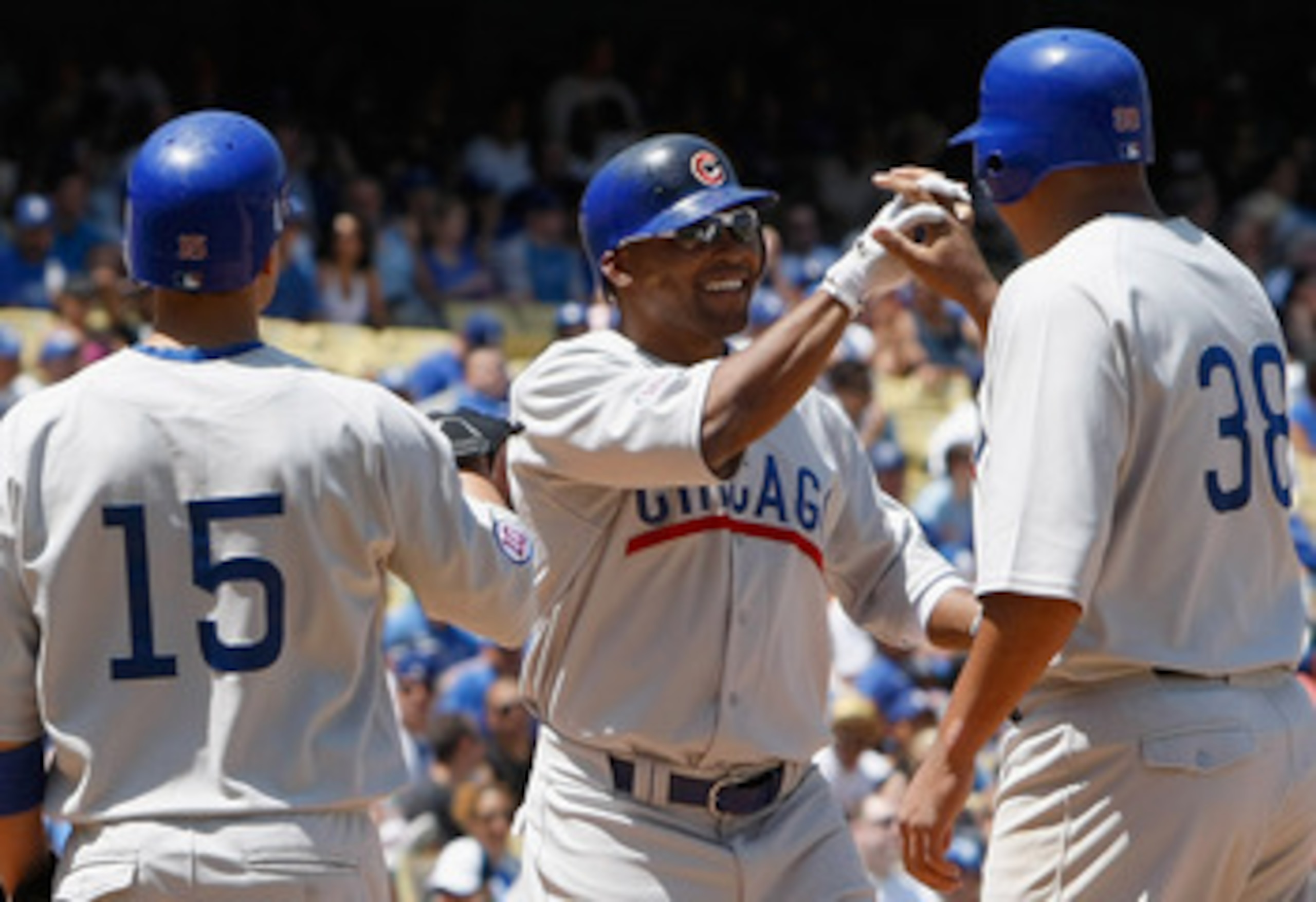 LOS ANGELES, CA - MAY 04:  (L-R) Darwin Barney #15, Marlon Byrd #24 and Carlos Zambrano #38 of the Chicago Cubs celebrate Byrd's three-run home run in the sixth inning against the Los Angeles Dodgers at Dodger Stadium on May 4, 2011 in Los Angeles, Califo
