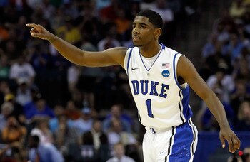 CHARLOTTE, NC - MARCH 18:  Kyrie Irving #1 of the Duke Blue Devils points in the first half while taking on the Hampton Pirates during the second round of the 2011 NCAA men's basketball tournament at Time Warner Cable Arena on March 18, 2011 in Charlotte,