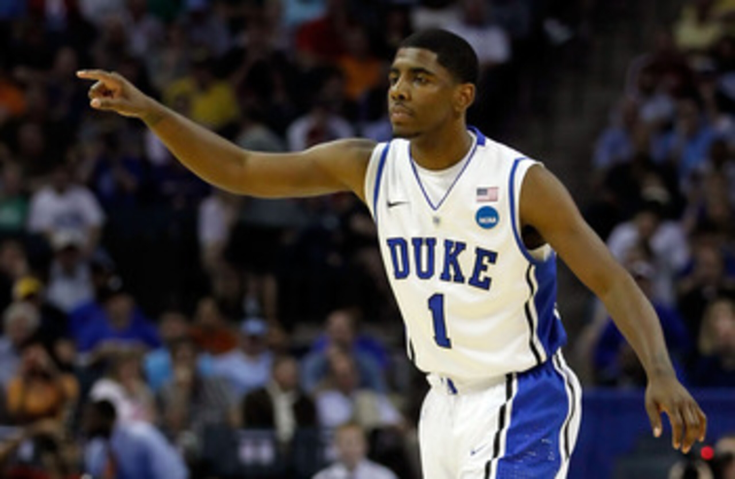 CHARLOTTE, NC - MARCH 18:  Kyrie Irving #1 of the Duke Blue Devils points in the first half while taking on the Hampton Pirates during the second round of the 2011 NCAA men's basketball tournament at Time Warner Cable Arena on March 18, 2011 in Charlotte,