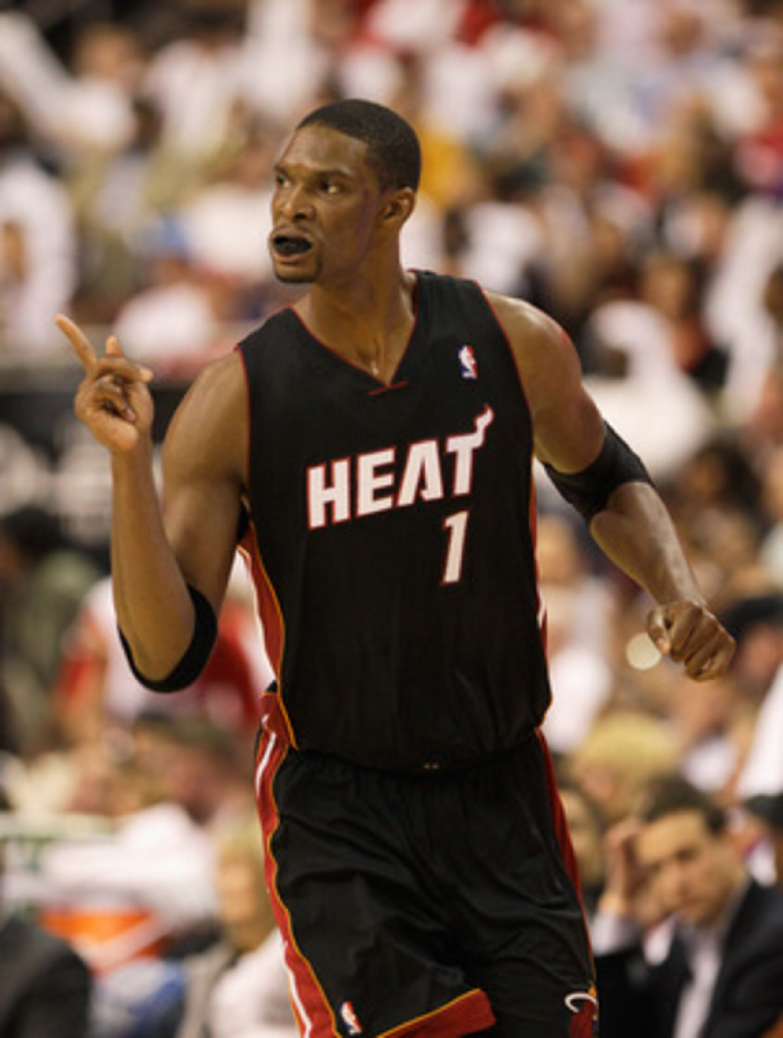 PHILADELPHIA, PA - APRIL 21: Chris Bosh #1 of the Miami Heat reacts after scoring against the Philadelphia 76ers during the second half of game three of the Eastern Conference Quarterfinals at Wells Fargo Center on April 21, 2011 in Philadelphia, Pennsylv
