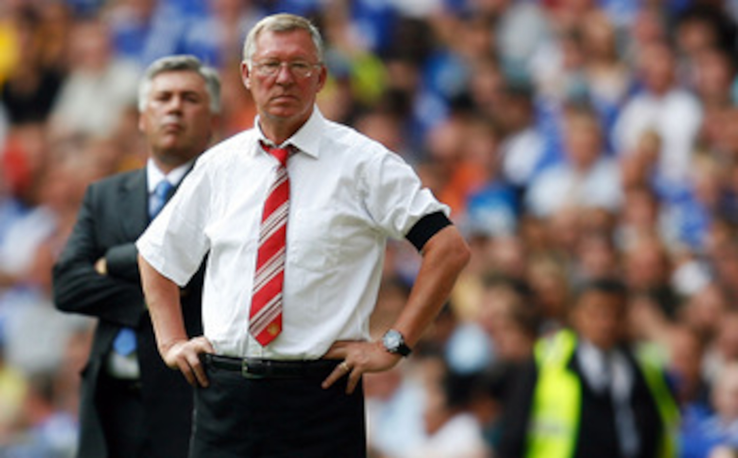 LONDON, ENGLAND - AUGUST 09:  Sir Alex Ferguson manager of Manchester United and Carlo Ancelotti manager of Chelsea look on during the FA Community Shield match between Manchester United and Chelsea at Wembley Stadium on August 9, 2009 in London, England.