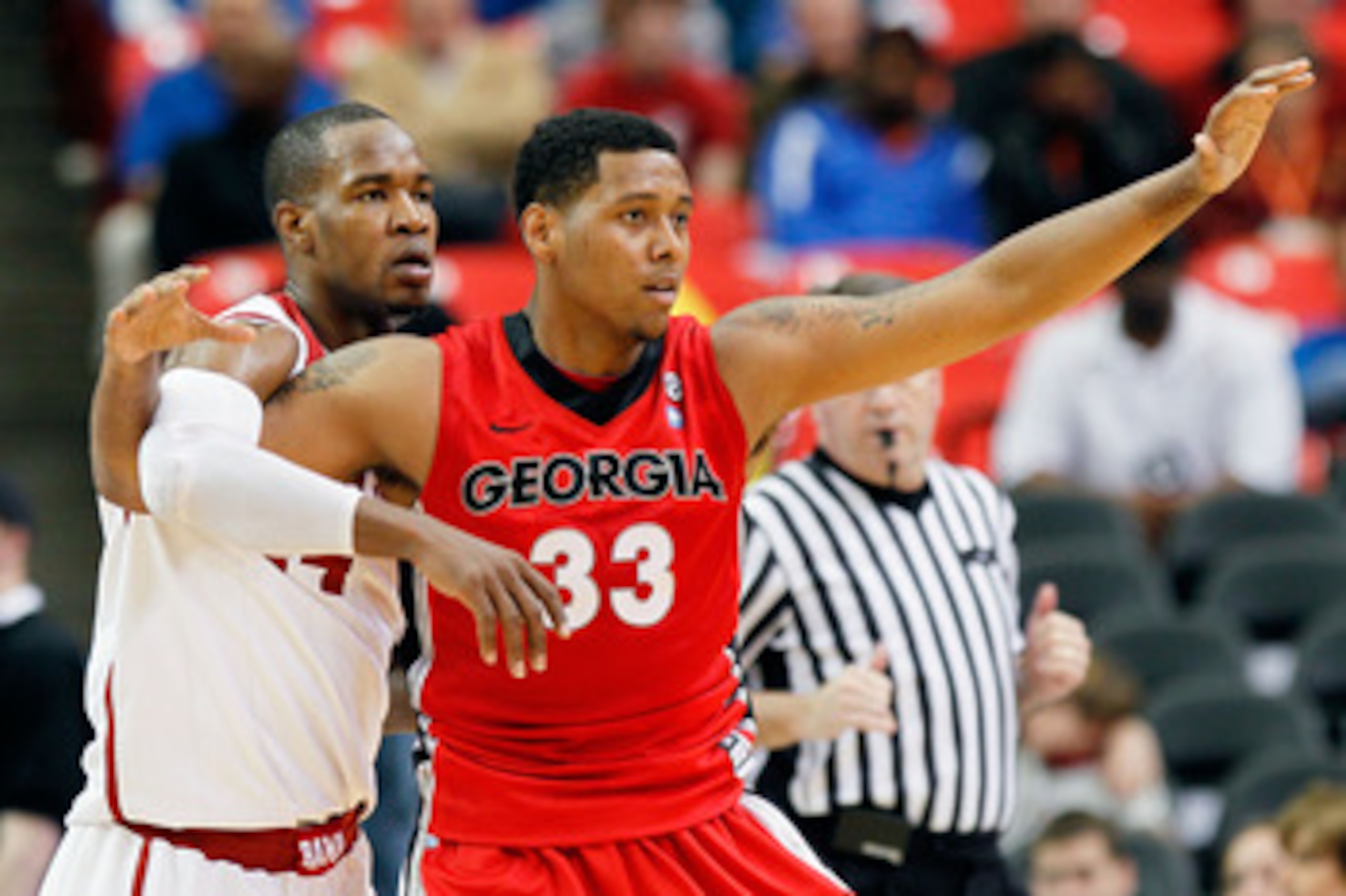 ATLANTA, GA - MARCH 11:  Trey Thompkins #33 of the Georgia Bulldogs vies for position with Chris Hines #44 of the Alabama Crimson Tide during the quarterfinals of the SEC Men's Basketball Tournament at Georgia Dome on March 11, 2011 in Atlanta, Georgia.  