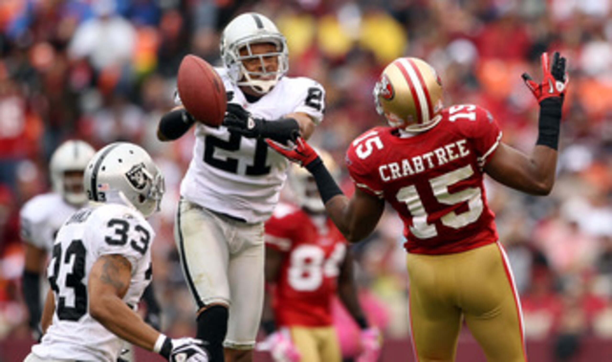 SAN FRANCISCO - OCTOBER 17:  Nnamdi Asomugha  #21 of the Oakland Raiders breaks up a pass intended for Michael Crabtree #15 of the San Francisco 49ers at Candlestick Park on October 17, 2010 in San Francisco, California.  (Photo by Ezra Shaw/Getty Images)