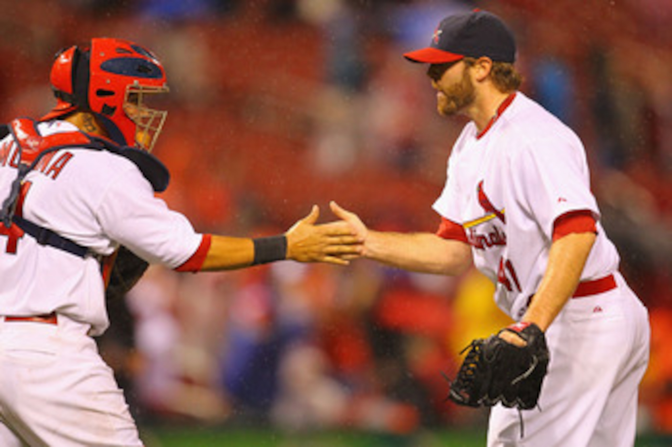 ST. LOUIS, MO - APRIL 24: Reliever Mitchell Boggs #41 and Yadier Molina #4 of the St. Louis Cardinals celebrate defeating the Cincinnati Reds at Busch Stadium on April 24, 2011 in St. Louis, Missouri.  (Photo by Dilip Vishwanat/Getty Images)