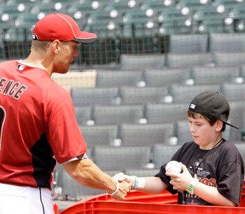 HOUSTON - APRIL 08:  Right fielder Hunter Pence of the Houston Astros shakes hands with eleven year old Kendal Robinson during batting practice before the game against the Florida Marlins at Minute Maid Park on April 8, 2011 in Houston, Texas.  (Photo by