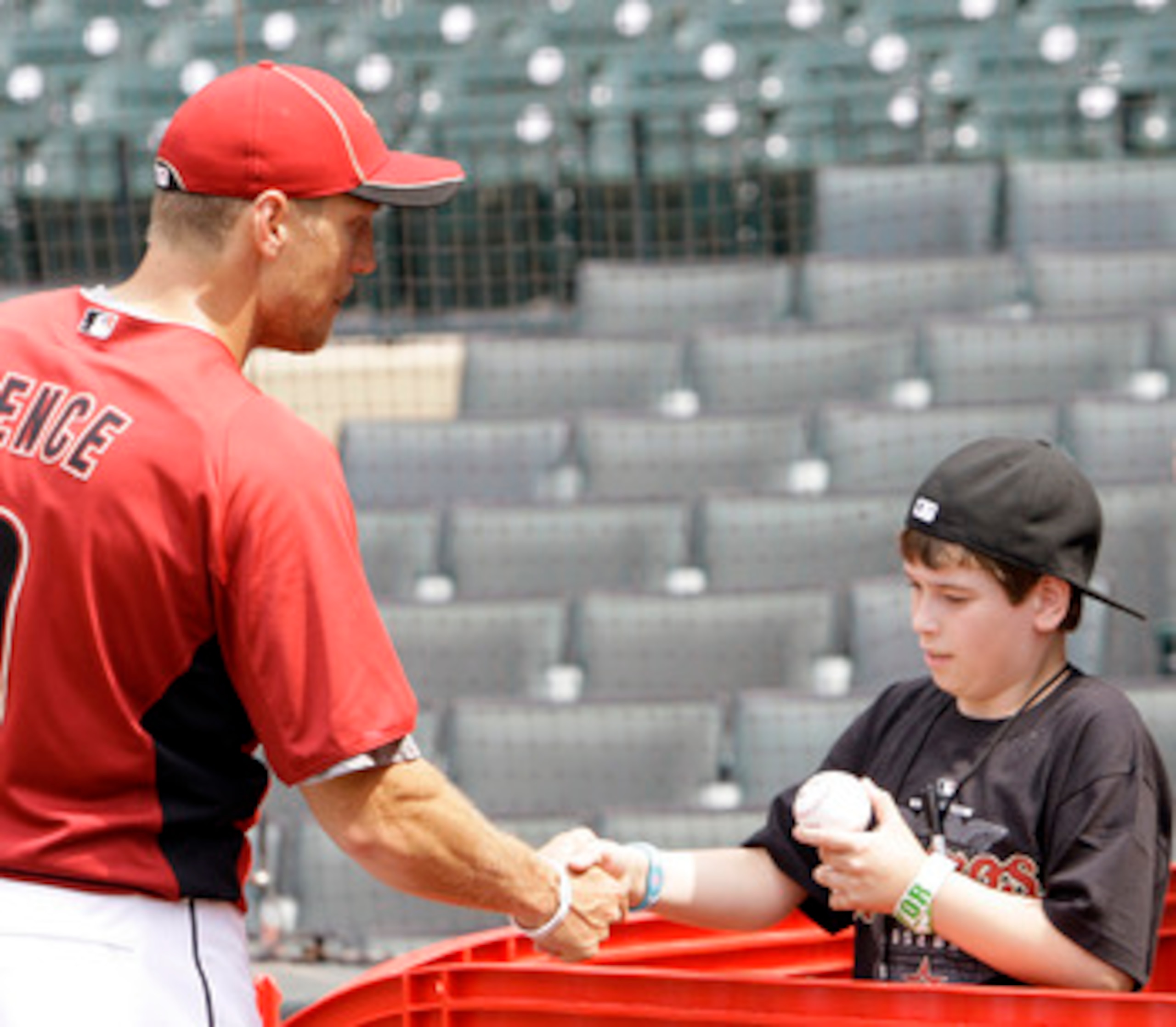 HOUSTON - APRIL 08: Right fielder Hunter Pence of the Houston Astros shakes hands with eleven year old Kendal Robinson during batting practice before the game against the Florida Marlins at Minute Maid Park on April 8, 2011 in Houston, Texas. (Photo by HOUSTON - APRIL 08: Right fielder Hunter Pence of the Houston Astros shakes hands with eleven year old Kendal Robinson during batting practice before the game against the Florida Marlins at Minute Maid Park on April 8, 2011 in Houston, Texas. (Photo by