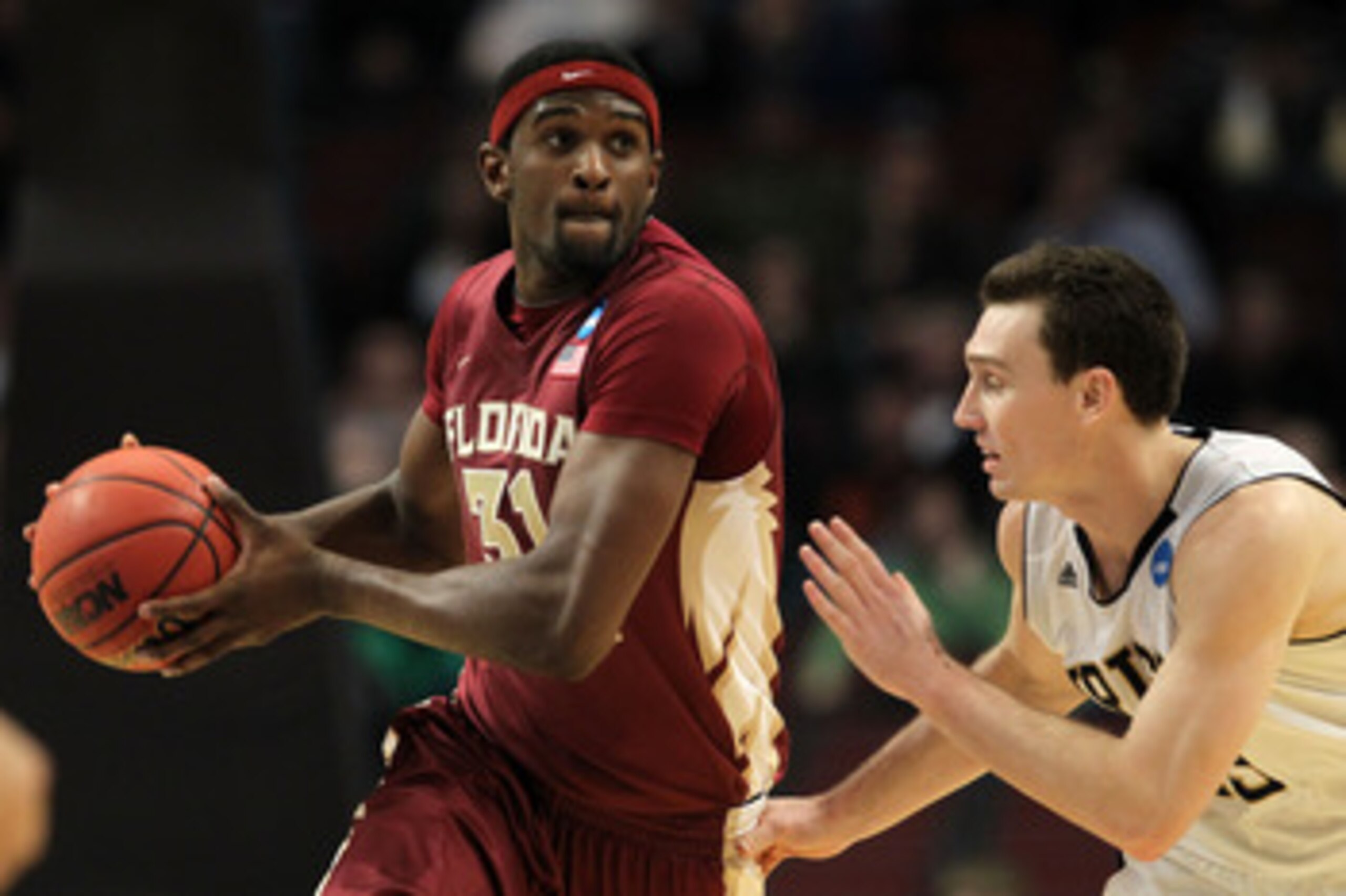 CHICAGO, IL - MARCH 20:  Chris Singleton #31 of the Florida State Seminoles drives against Ben Hansbrough #23 of the Notre Dame Fighting Irish in the second half during the third round of the 2011 NCAA men's basketball tournament at the United Center on M