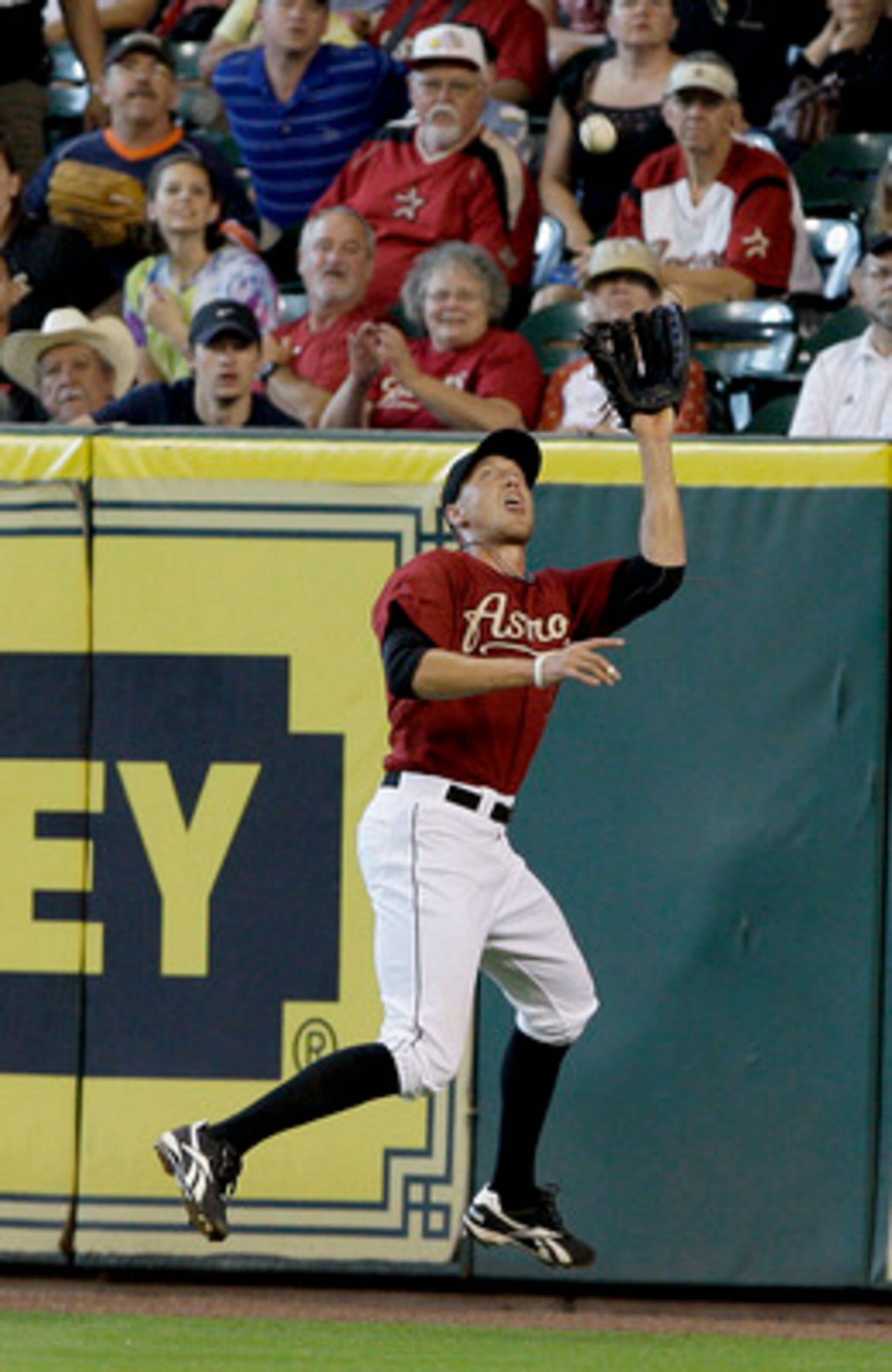 HOUSTON,TX- APRIL 10 : Right fielder Hunter Pence #9 of the Houston Astros catches Wes Helms #18 of the Florida Marlins fly ball on the warning track in the second inning in a MLB baseball game on April 10, 2011 at Minute Maid Park in Houston, Texas. (P HOUSTON,TX- APRIL 10 : Right fielder Hunter Pence #9 of the Houston Astros catches Wes Helms #18 of the Florida Marlins fly ball on the warning track in the second inning in a MLB baseball game on April 10, 2011 at Minute Maid Park in Houston, Texas. (P