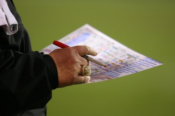 CHICAGO - NOVEMBER 22: Head coach Andy Reid of the Philadelphia Eagles makes notes during a game against the Chicago Bears at Soldier Field on November 22, 2009 in Chicago, Illinois. The Eagles defeated the Bears 24-20. (Photo by Jonathan Daniel/Getty Ima