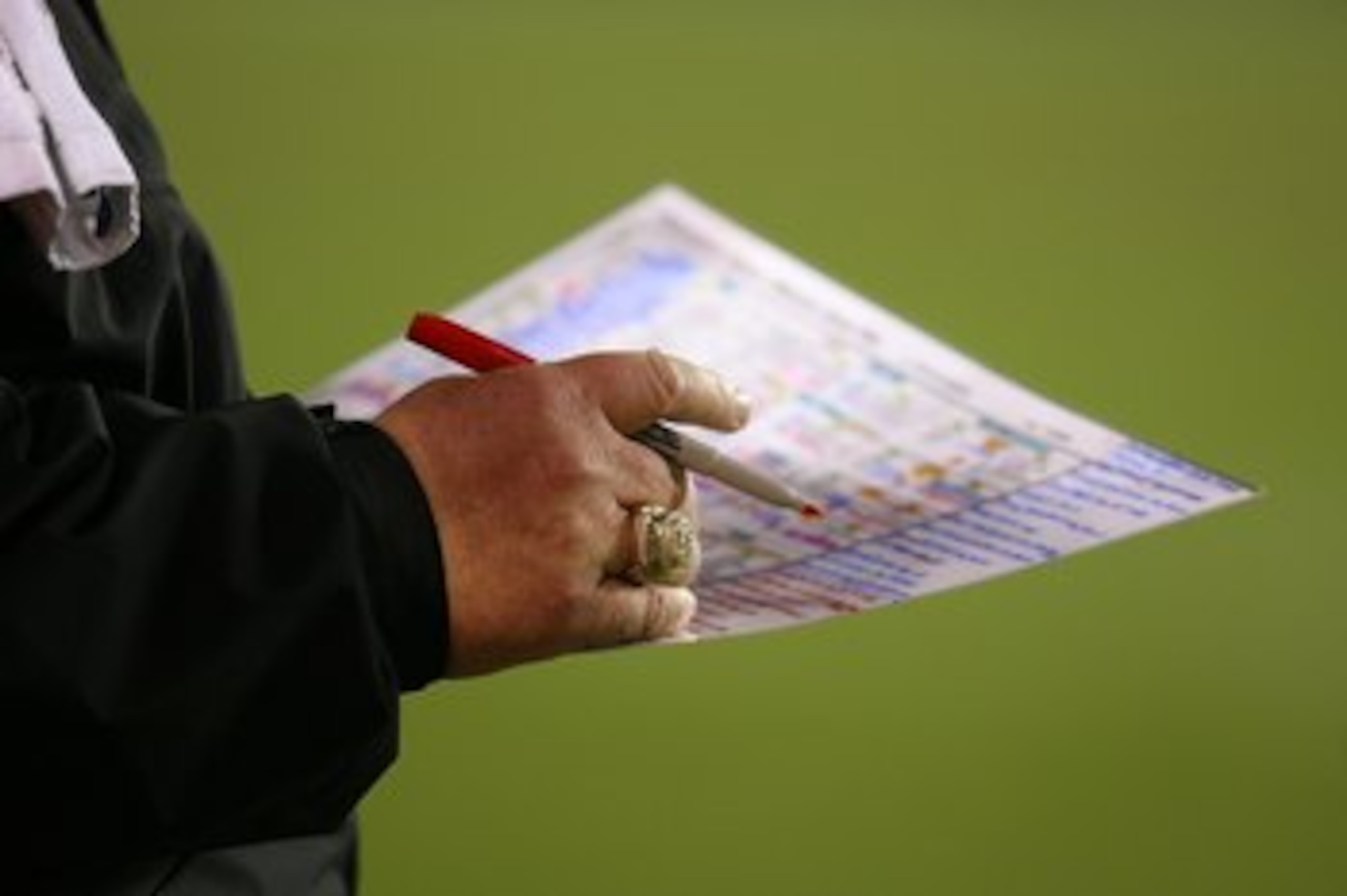 CHICAGO - NOVEMBER 22: Head coach Andy Reid of the Philadelphia Eagles makes notes during a game against the Chicago Bears at Soldier Field on November 22, 2009 in Chicago, Illinois. The Eagles defeated the Bears 24-20. (Photo by Jonathan Daniel/Getty Ima