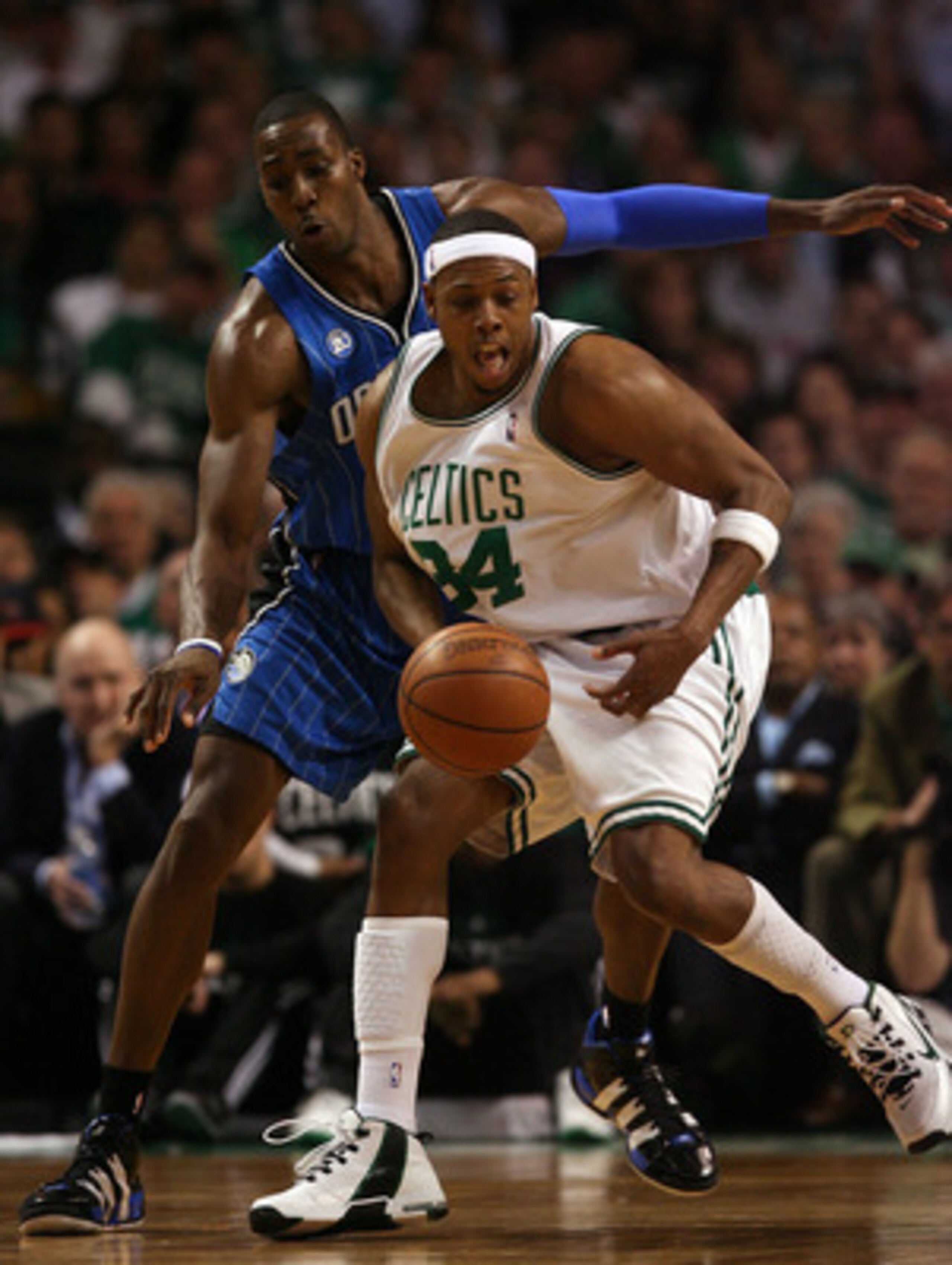 BOSTON - MAY 17:  Paul Pierce #34 of the Boston Celtics loses control of the ball as Dwight Howard #12  of the Orlando Magic defends in Game Seven of the Eastern Conference Semifinals during the 2009 NBA Playoffs at TD Banknorth Garden on May 17, 2009 in