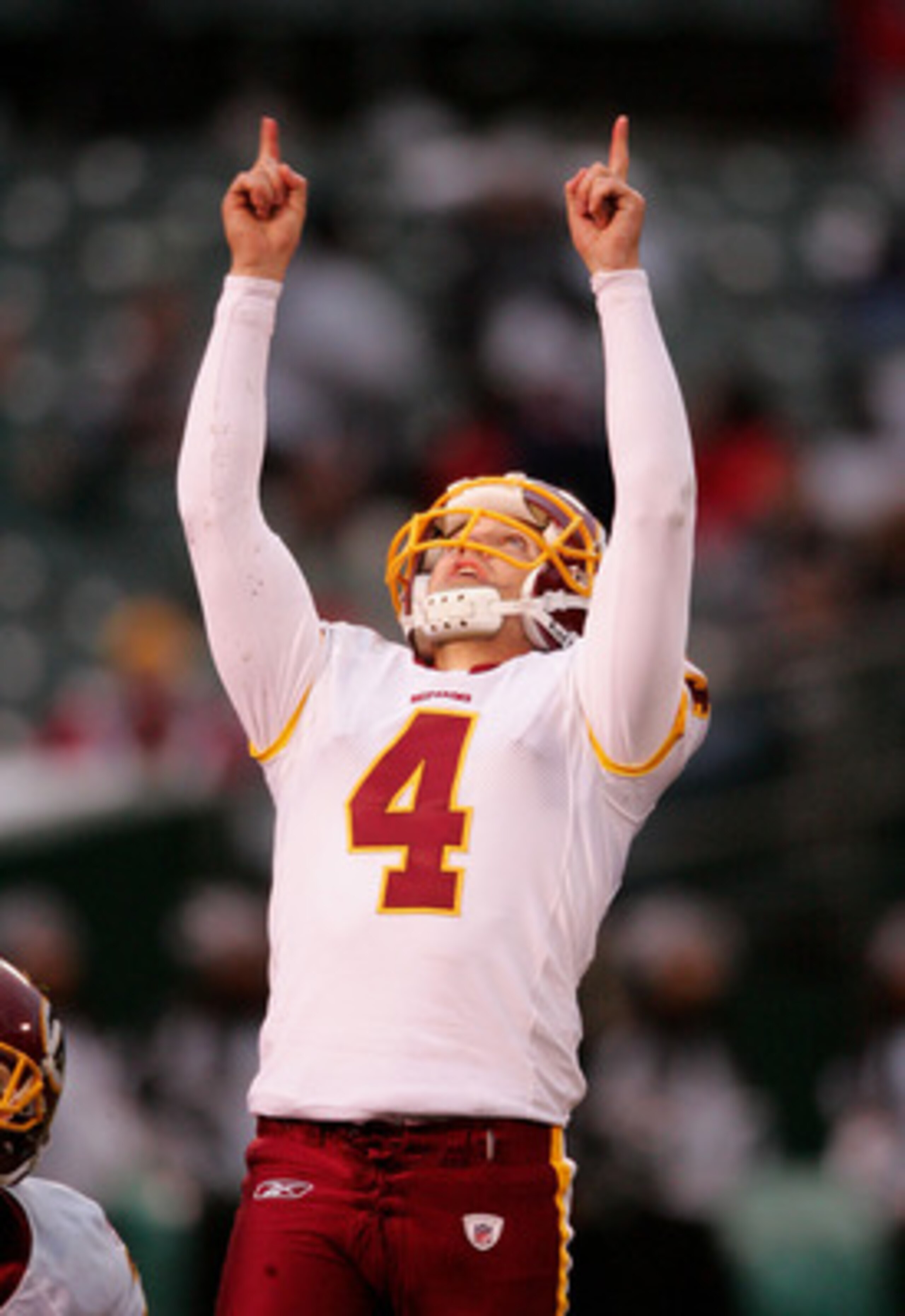 OAKLAND, CA - DECEMBER 13:  Graham Gano #4 of the Washington Redskins celebrates after making a field goal against the Oakland Raiders at Oakland-Alameda County Coliseum on December 13, 2009 in Oakland, California.  (Photo by Ezra Shaw/Getty Images)
