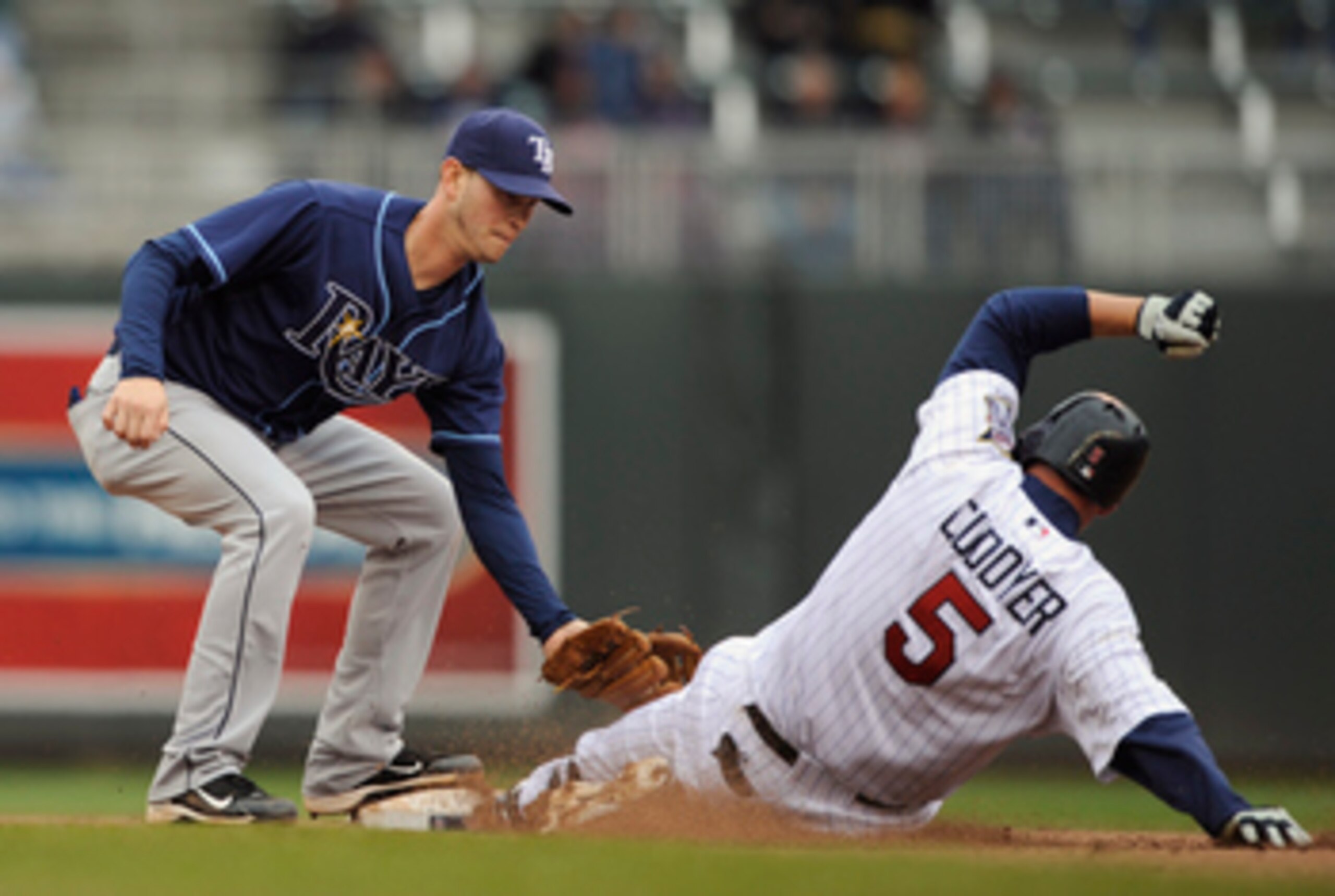 MINNEAPOLIS, MN - APRIL 28: Shortstop Reid Brignac #15 of the Tampa Bay Rays tags out Michael Cuddyer #5 of the Minnesota Twins at second base during in the eighth inning of their game on April 28, 2011 at Target Field in Minneapolis, Minnesota. Rays defe