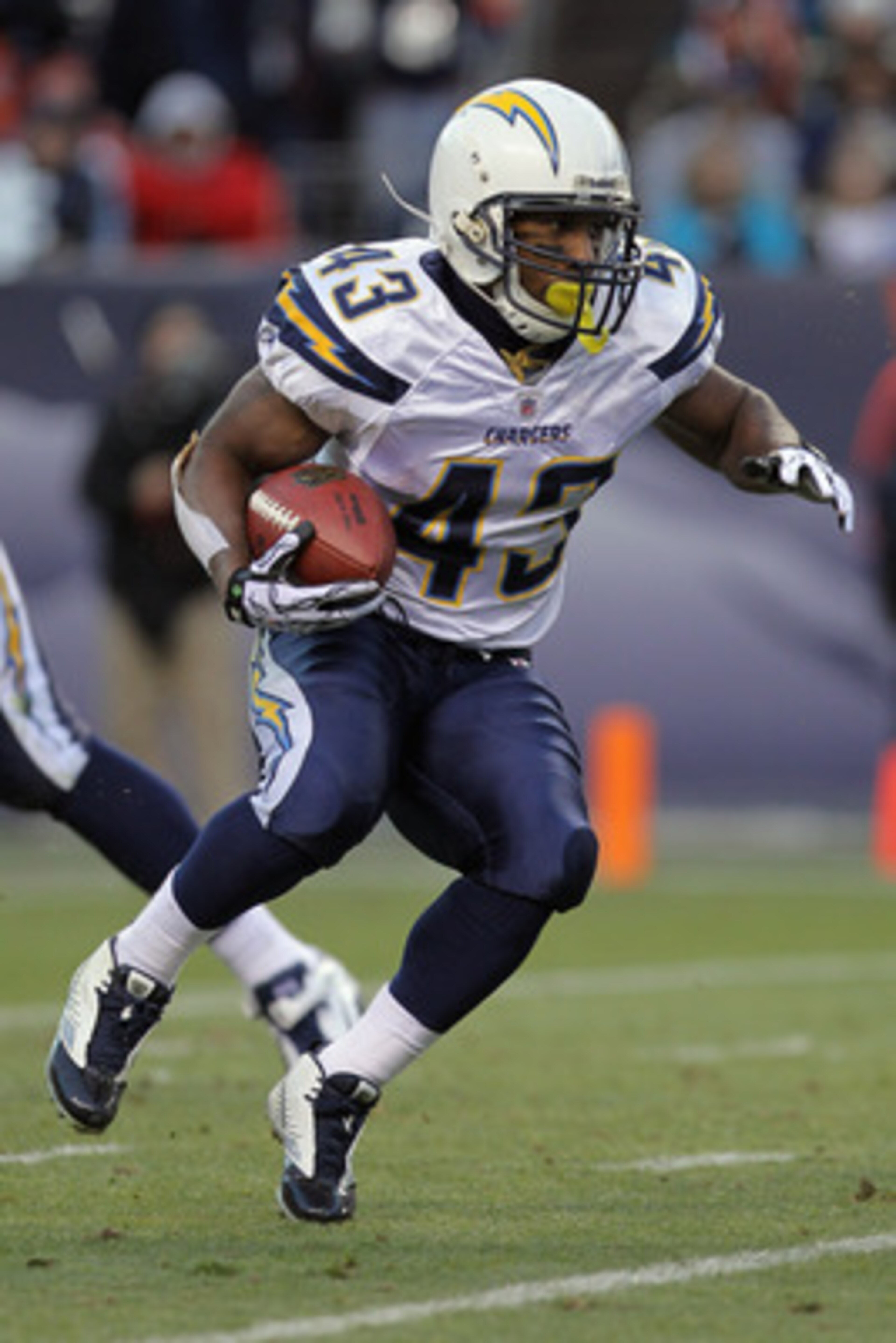 DENVER - JANUARY 02:  Running back Darren Sproles #43 of the San Diego Chargers rushes against the Denver Broncos at INVESCO Field at Mile High on January 2, 2011 in Denver, Colorado. The Chargers defeated the Broncos 33-28.  (Photo by Doug Pensinger/Gett