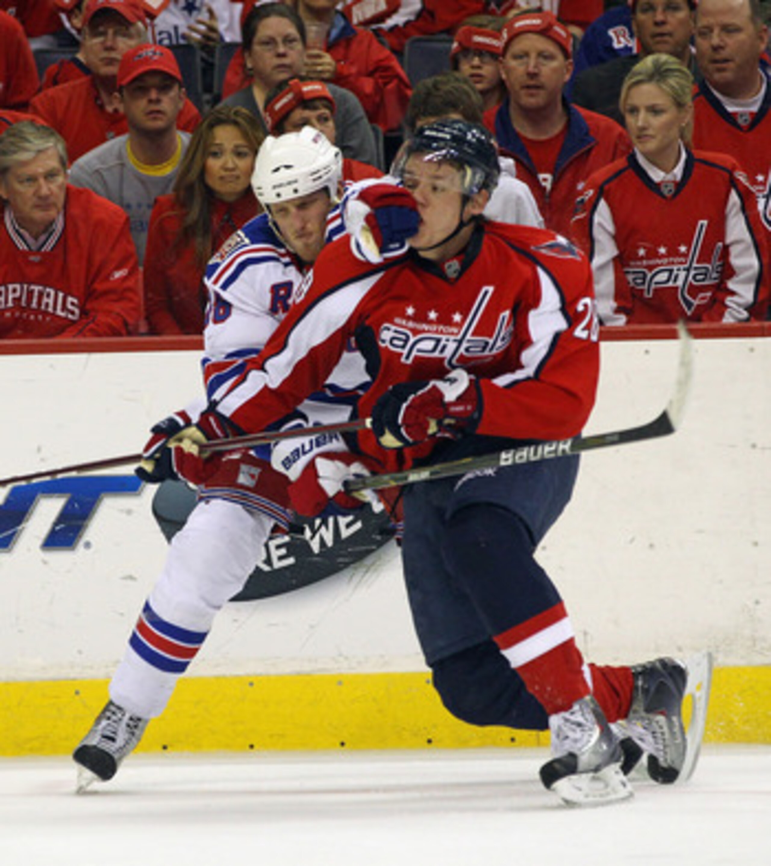WASHINGTON, DC - APRIL 15: Marc Staal #18 of the New York Rangers holds onto Alexander Semin #28 of the Washington Capitals in Game Two of the Eastern Conference Quarterfinals during the 2011 NHL Stanley Cup Playoffs at Verizon Center on April 15, 2011 in