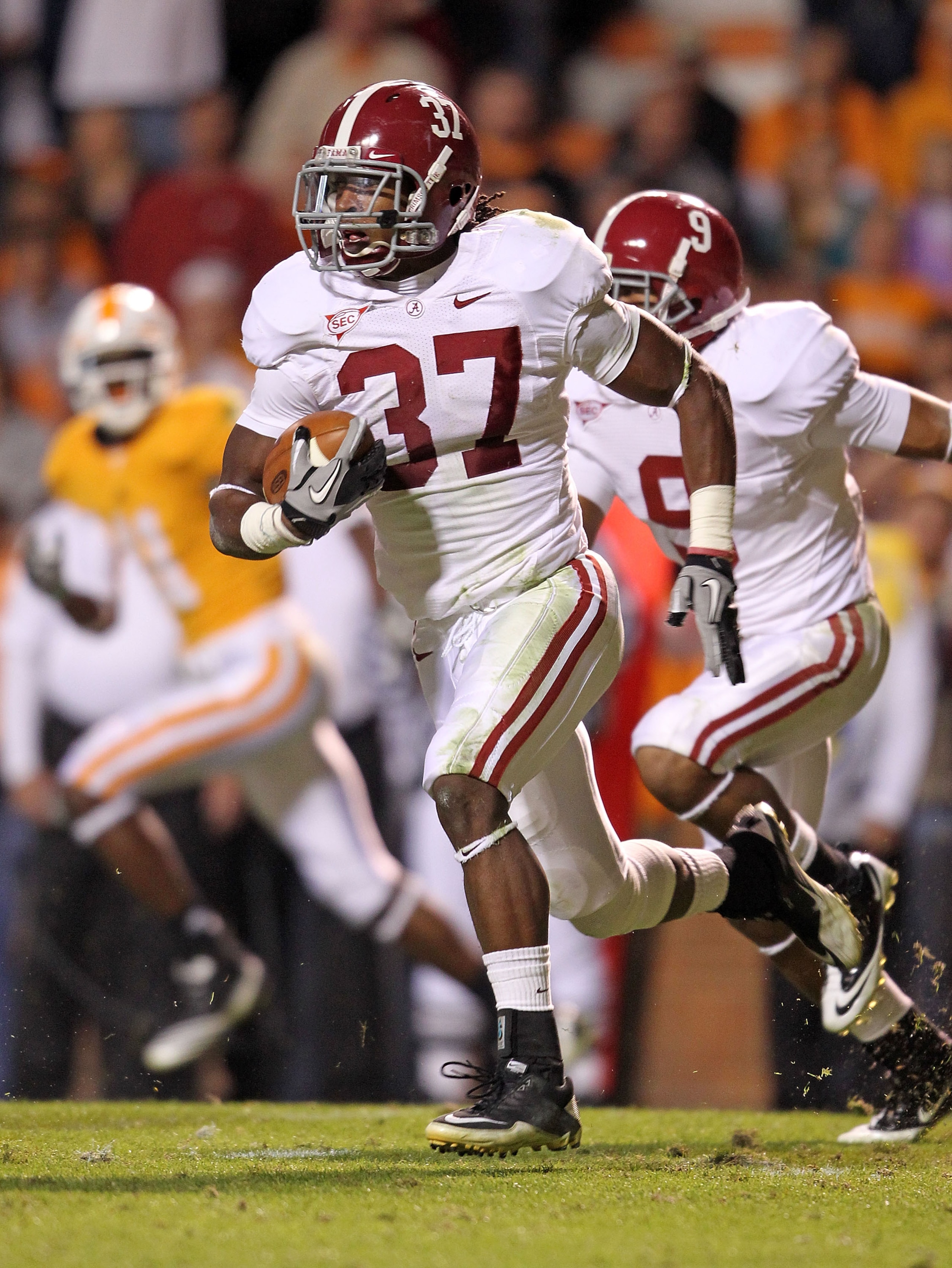KNOXVILLE, TN - OCTOBER 23:  Robert Lester #37 of the Alabama Crimson Tide runs with the ball after intercepting a pass during the SEC game against the Tennessee Volunteers at Neyland Stadium on October 23, 2010 in Knoxville, Tennessee.  (Photo by Andy Ly