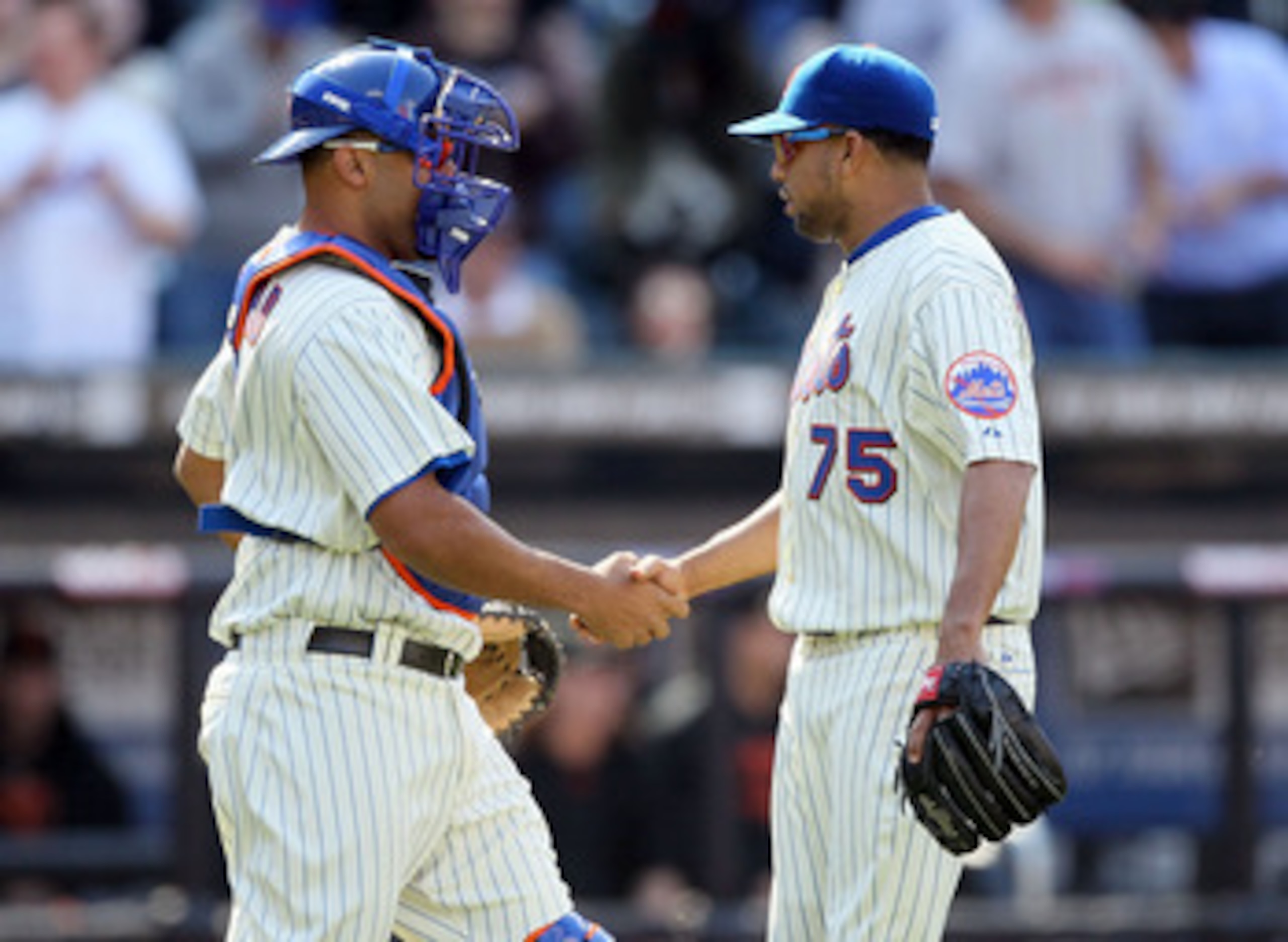 NEW YORK, NY - MAY 05:  Francisco Rodriguez #75 and Ronny Paulino #9 of the New York Mets celebrate after defeating the San Francisco Giants on May 5, 2011 at Citi Field in the Flushing neighborhood of the Queens borough of New York City. The Mets defeate