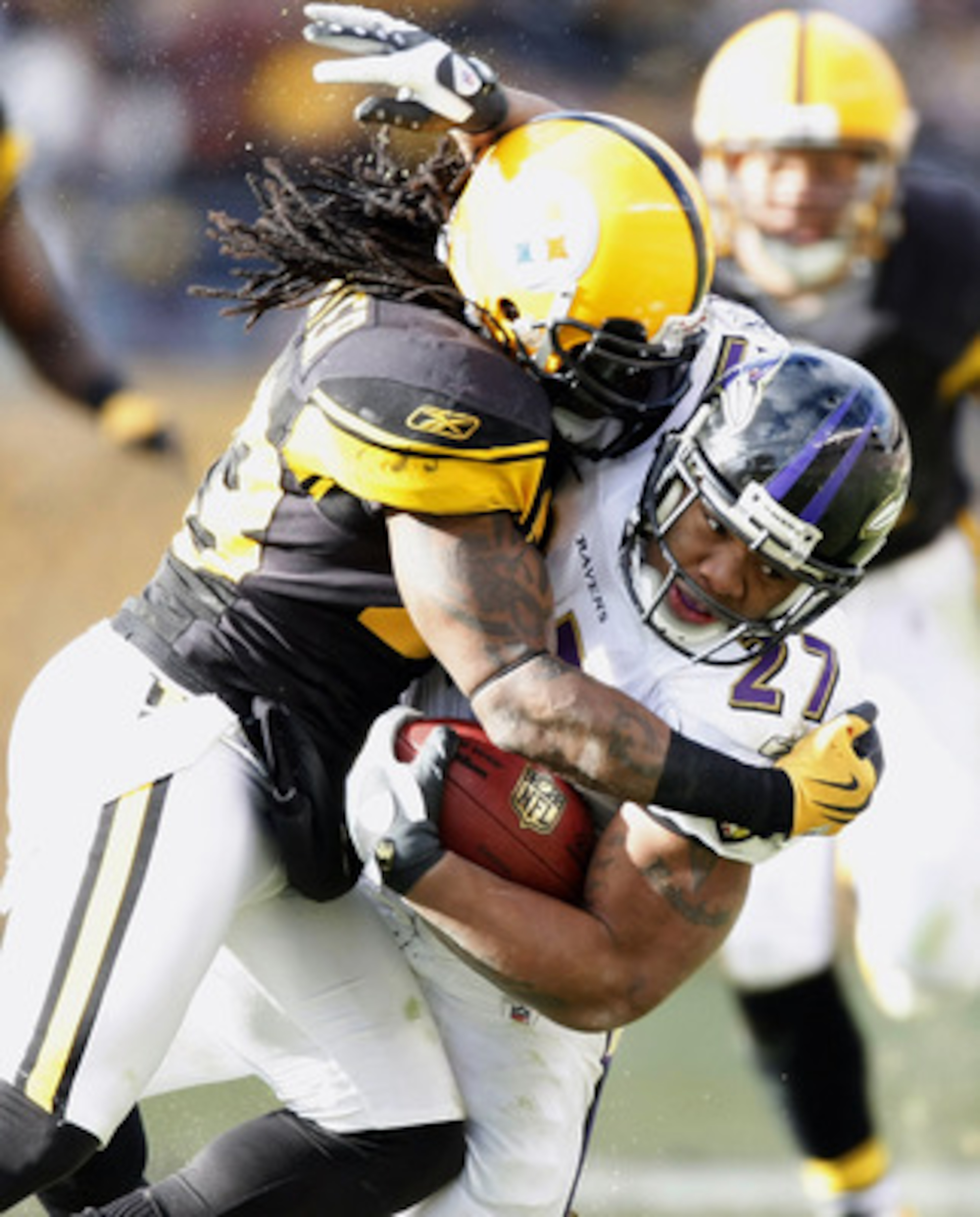 PITTSBURGH - DECEMBER 27: Ray Rice #27 of the Baltimore Ravens is tackled during a second quarter run by Tyrone Carter #23 of the Pittsburgh Steelers on December 27, 2009 at Heinz Field in Pittsburgh, Pennsylvania.  (Photo by Gregory Shamus/Getty Images)