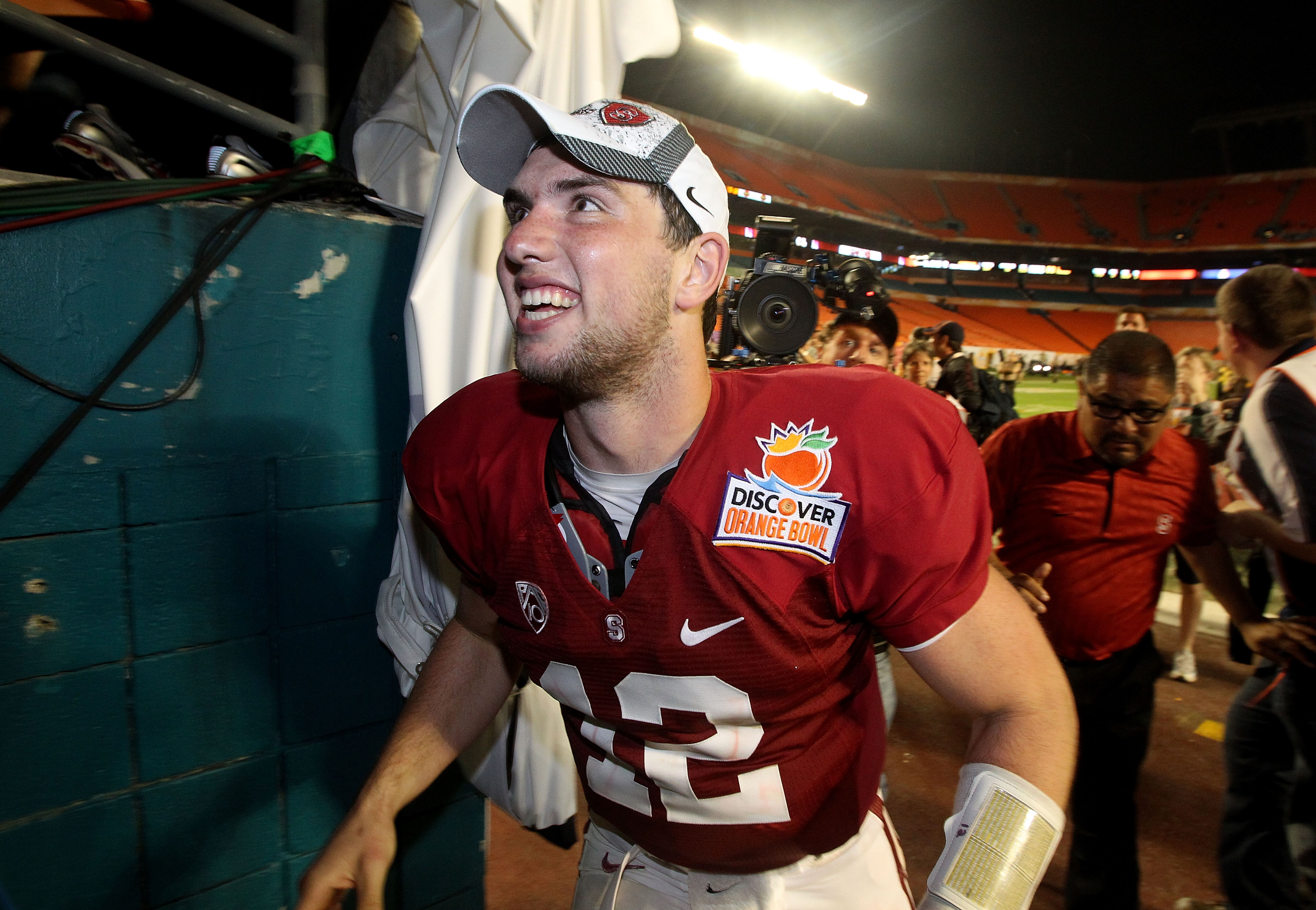 MIAMI, FL - JANUARY 03:  Andrew Luck #12 of the Stanford Cardinal celebrates as he walks off the field after Stanford won 40-12 against the Virginia Tech Hokies during the 2011 Discover Orange Bowl at Sun Life Stadium on January 3, 2011 in Miami, Florida.