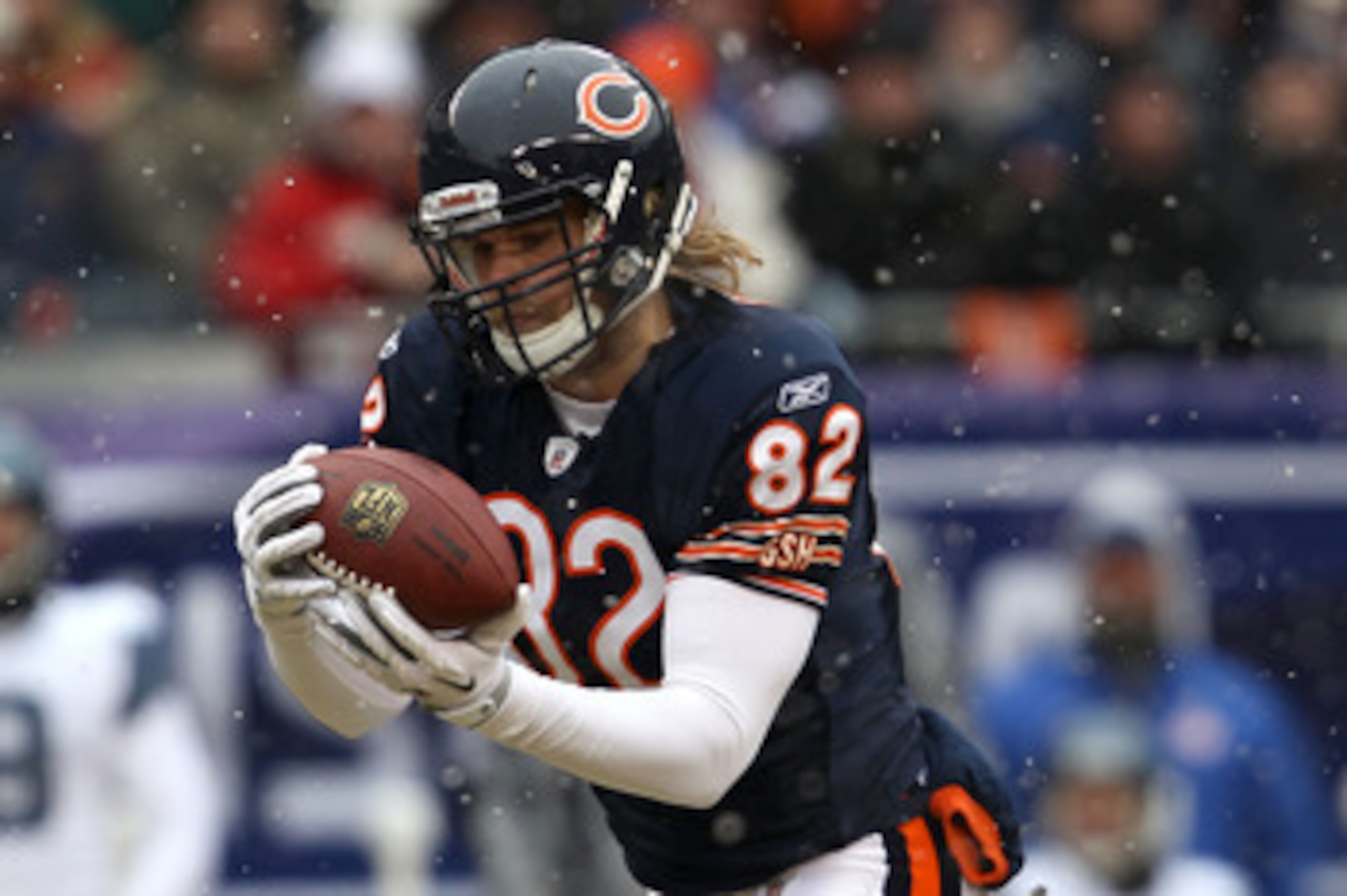CHICAGO, IL - JANUARY 16:  Tight end Greg Olsen #82 of the Chicago Bears catches a 58-yard touchdown in the first quarter in front of Lawyer Milloy #36 of the Seattle Seahawks in the 2011 NFC divisional playoff game at Soldier Field on January 16, 2011 in