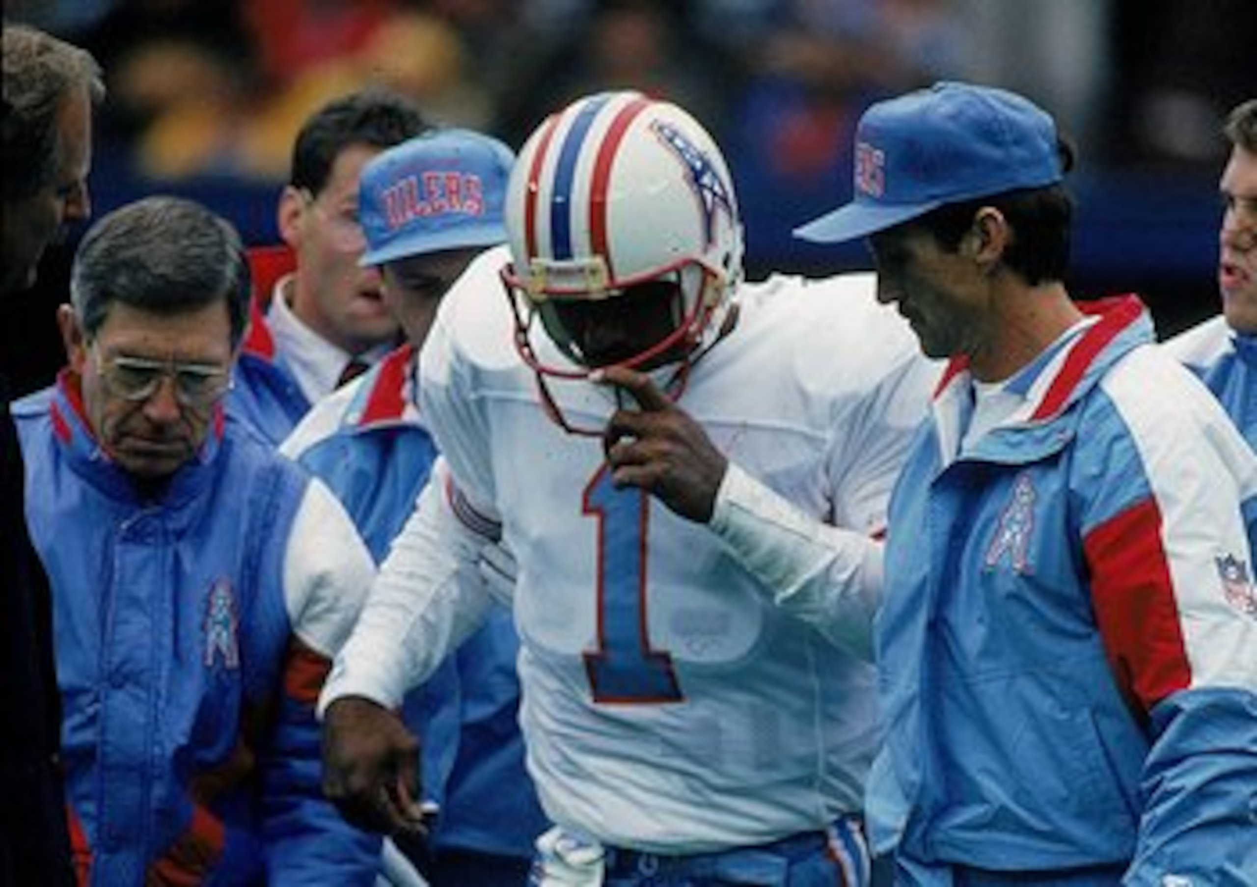 4 Nov 1992:  Quarterback Warren Moon #1 of the Oilers is injured during a game and helped off the field. Mandatory Credit: Jonathan Daniel  /Allsport