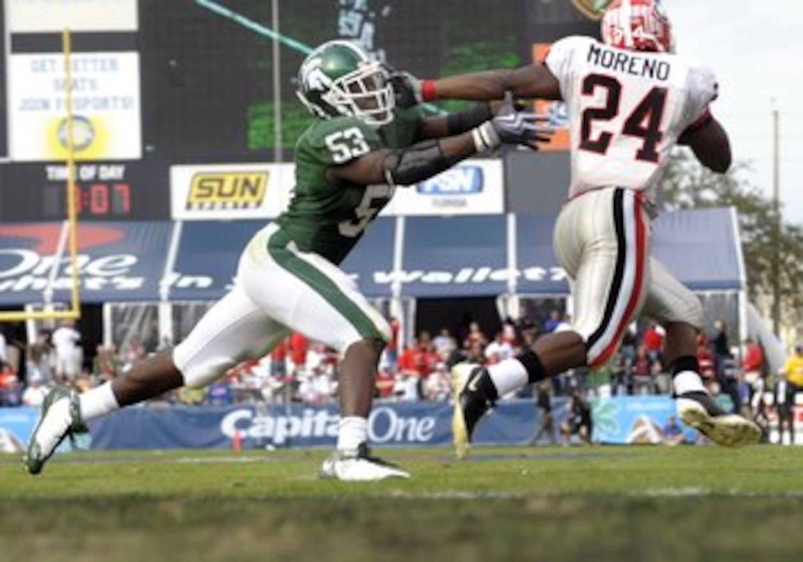 ORLANDO, FL - JANUARY 1: Running back Knowshon Moreno #24 of the University of Georgia rushes around linebacker Greg Jones #53 of the Michigan State Spartans at the 2009 Capital One Bowl at the Citrus Bowl on January 1, 2009 in Orlando, Florida. (Photo b ORLANDO, FL - JANUARY 1: Running back Knowshon Moreno #24 of the University of Georgia rushes around linebacker Greg Jones #53 of the Michigan State Spartans at the 2009 Capital One Bowl at the Citrus Bowl on January 1, 2009 in Orlando, Florida. (Photo b