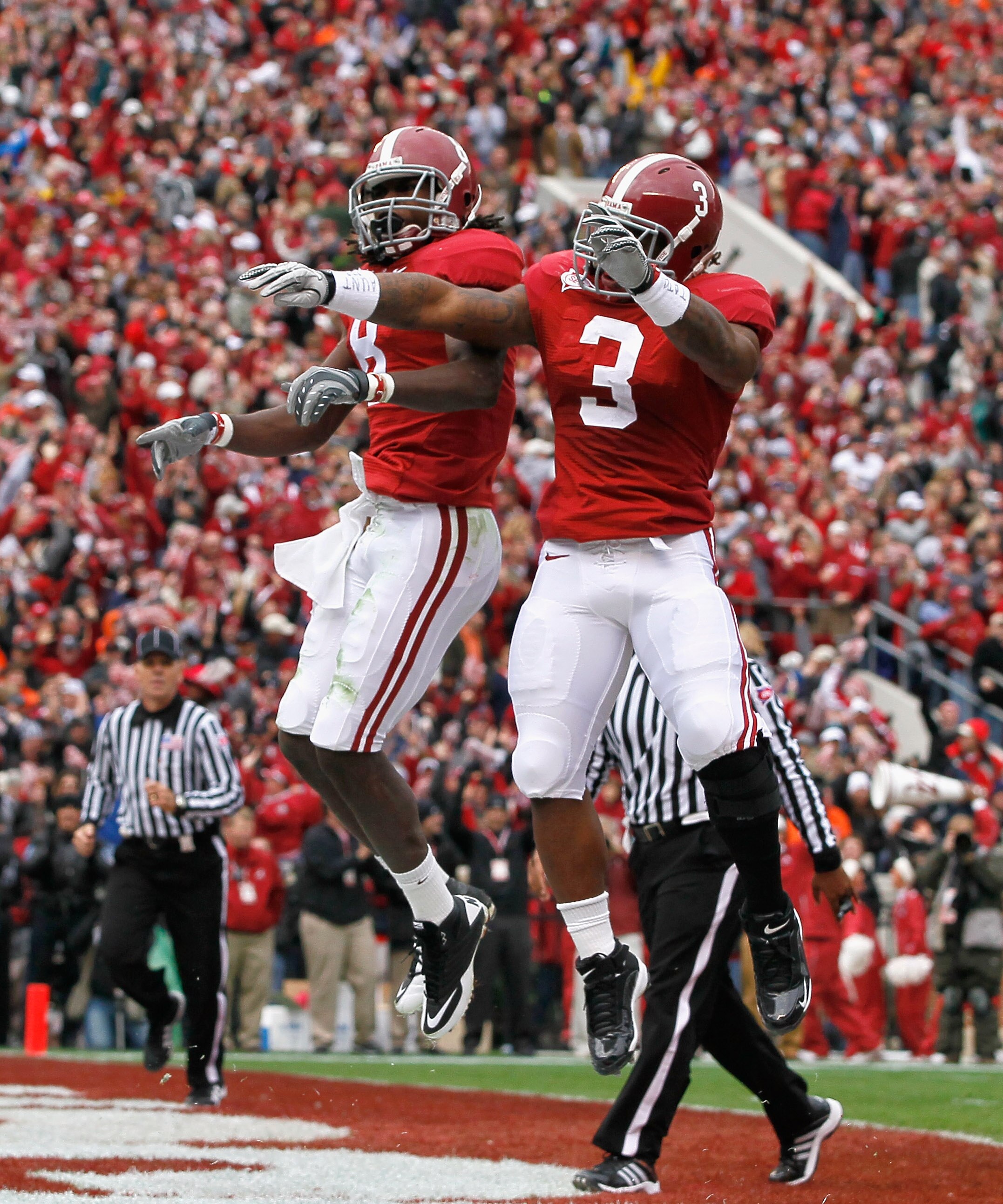 TUSCALOOSA, AL - NOVEMBER 26:  Julio Jones #8 and Trent Richardson #3 of the Alabama Crimson Tide reacts after Jones' touchdown against the Auburn Tigers at Bryant-Denny Stadium on November 26, 2010 in Tuscaloosa, Alabama.  (Photo by Kevin C. Cox/Getty Im