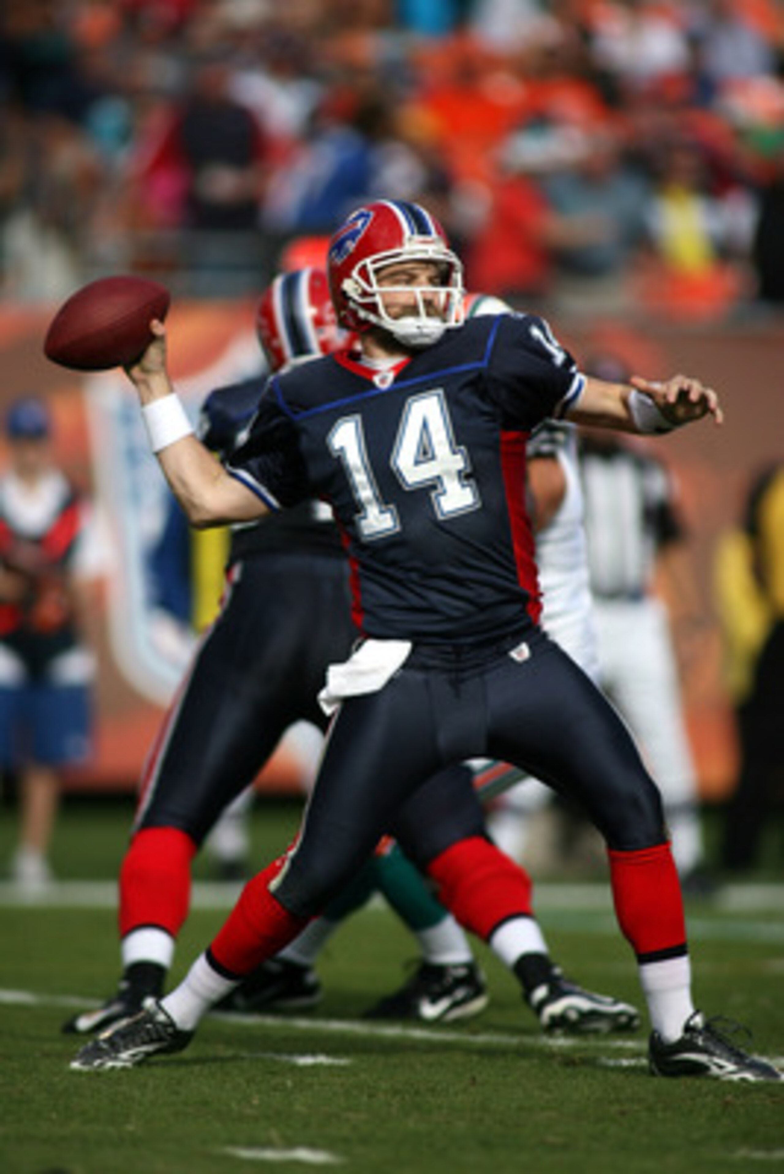 MIAMI - DECEMBER 19:  Quarterback Ryan Fitzpatrick #14 of the Buffalo Bills throws against the Miami Dolphins at Sun Life Stadium on December 19, 2010 in Miami, Florida.The Bills defeated the Dolphins 17-14.  (Photo by Marc Serota/Getty Images)