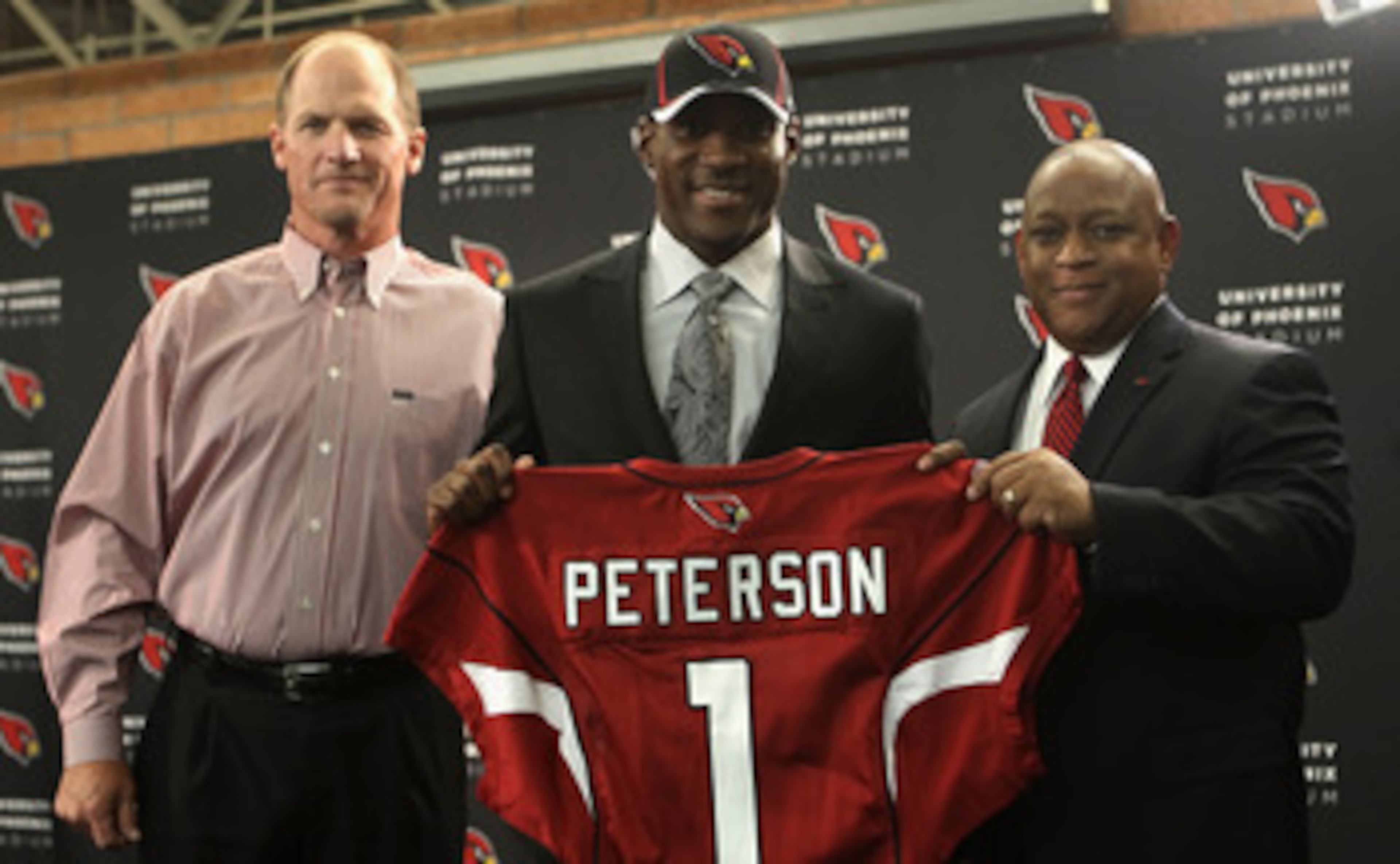 TEMPE, AZ - APRIL 29:  (L-R) Head coach Ken Whisenhunt, first round draft pick Patrick Peterson and general manager Rod Graves of the Arizona Cardinals pose together during a press conference to introduce Peterson at the team's training center auditorium
