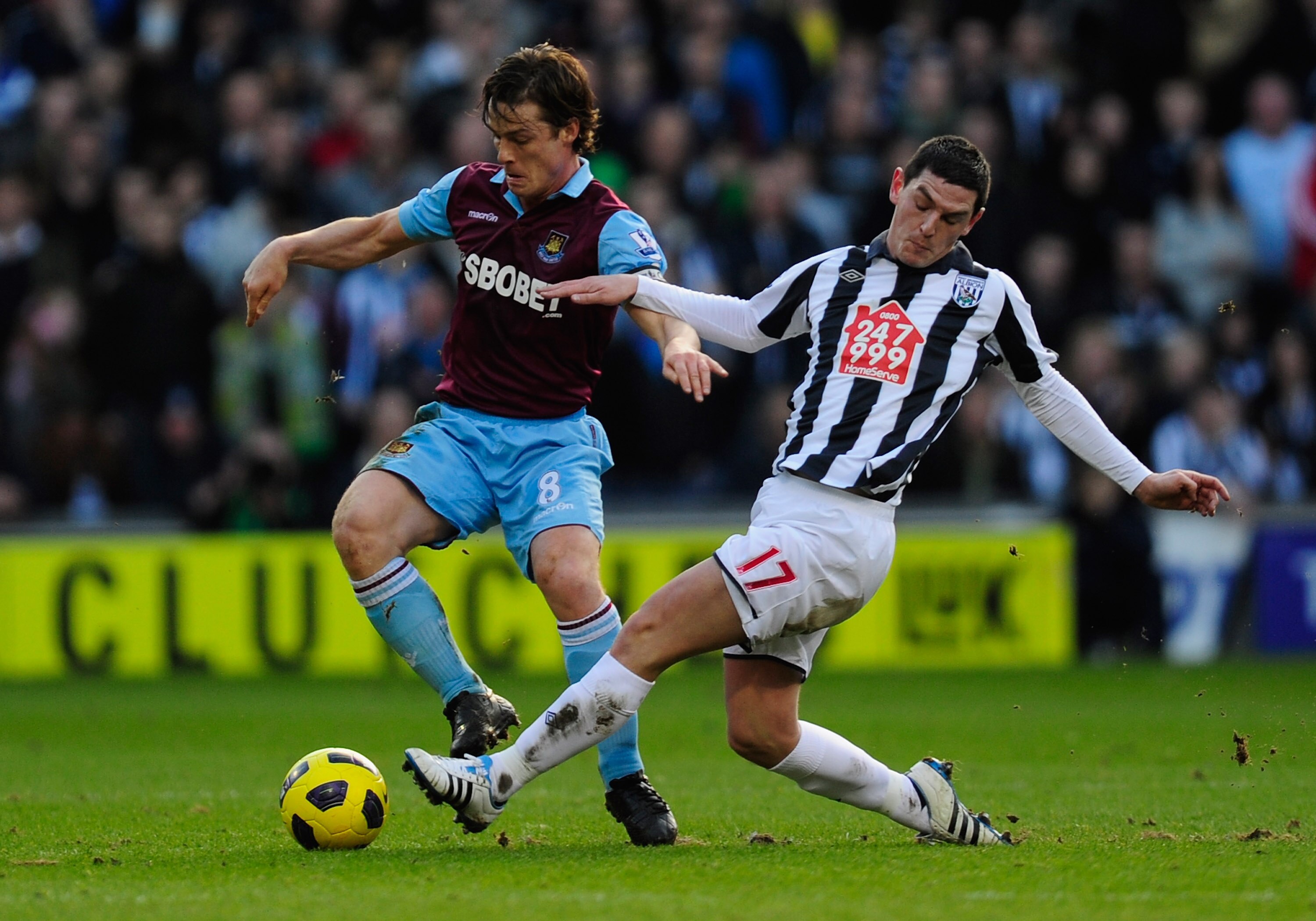 WEST BROMWICH, ENGLAND - FEBRUARY 12:  Graham Dorrans of West Bromwich Albion battles with Scott Parker of West Ham United during the Barclays Premier League match between West Bromwich Albion and West Ham United at The Hawthorns on February 12, 2011 in W