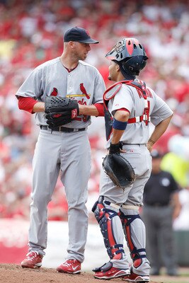 CINCINNATI, OH - APRIL 5: Chris Carpenter #29 and Yadier Molina #4 of the St. Louis Cardinals talk at the mound during the game against the Cincinnati Reds at the Great American Ball Park on March 5, 2010 in Cincinnati, Ohio. (Photo by Joe Robbins/Getty I