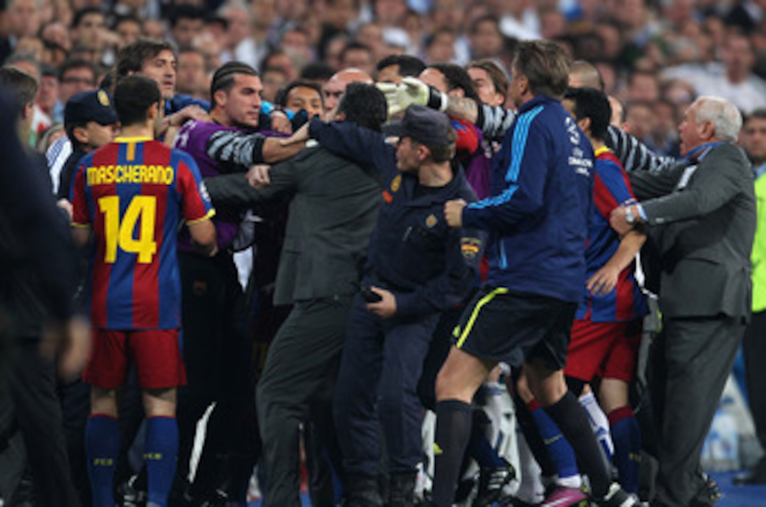 MADRID, SPAIN - APRIL 27:  Jose Pinto of Barcelona clashes with Real Madrid official as the players leave the pitch at half time during the UEFA Champions League Semi Final first leg match between Real Madrid and Barcelona at Estadio Santiago Bernabeu on