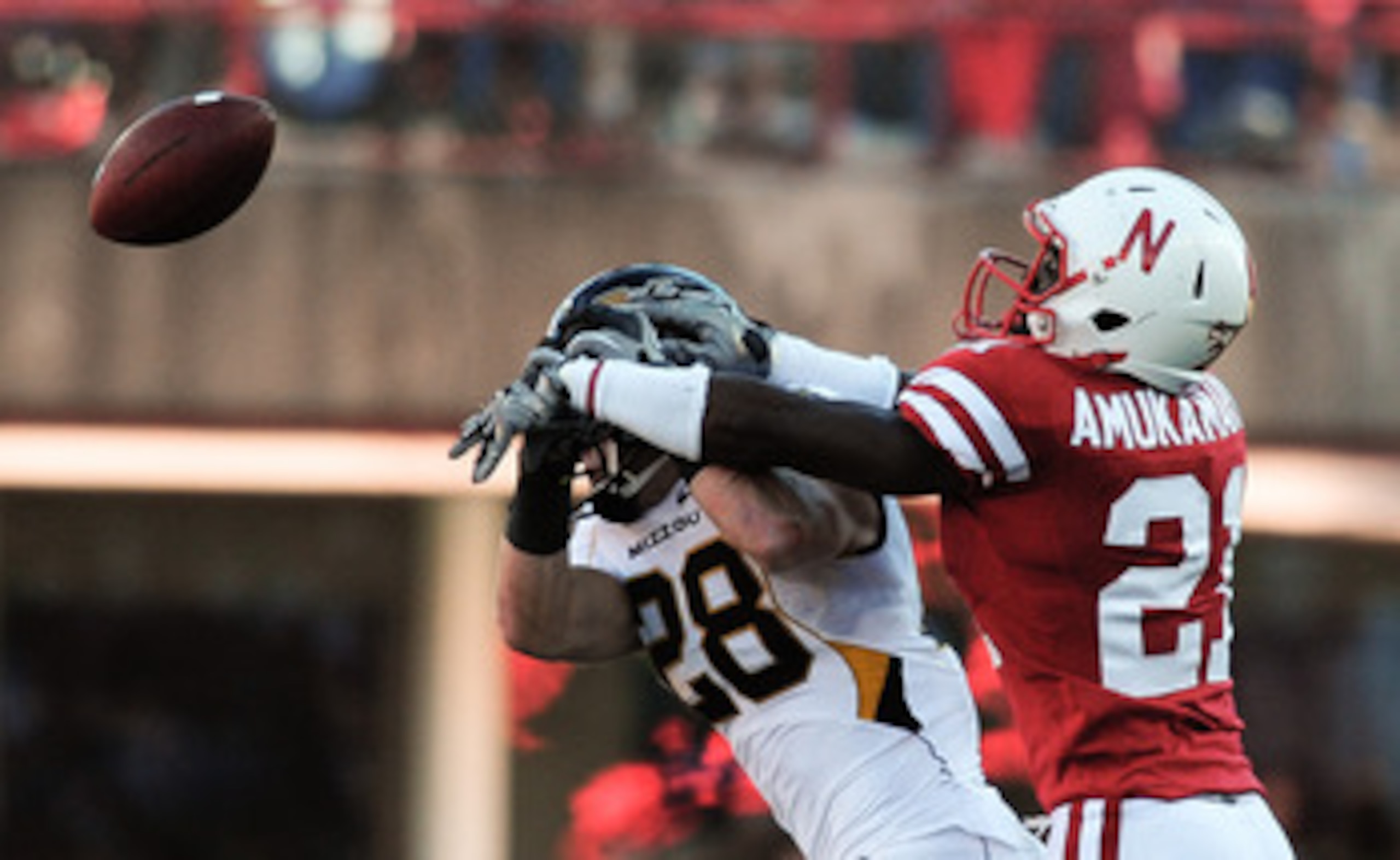 LINCOLN, NE - OCTOBER 30: Cornerback Prince Amukamara #21 of the Nebraska Cornhuskers breaks up a pass intended for wide receiver T.J. Moe #28 of the Missouri Tigers during first half action of their game at Memorial Stadium on October 30, 2010 in Lincoln
