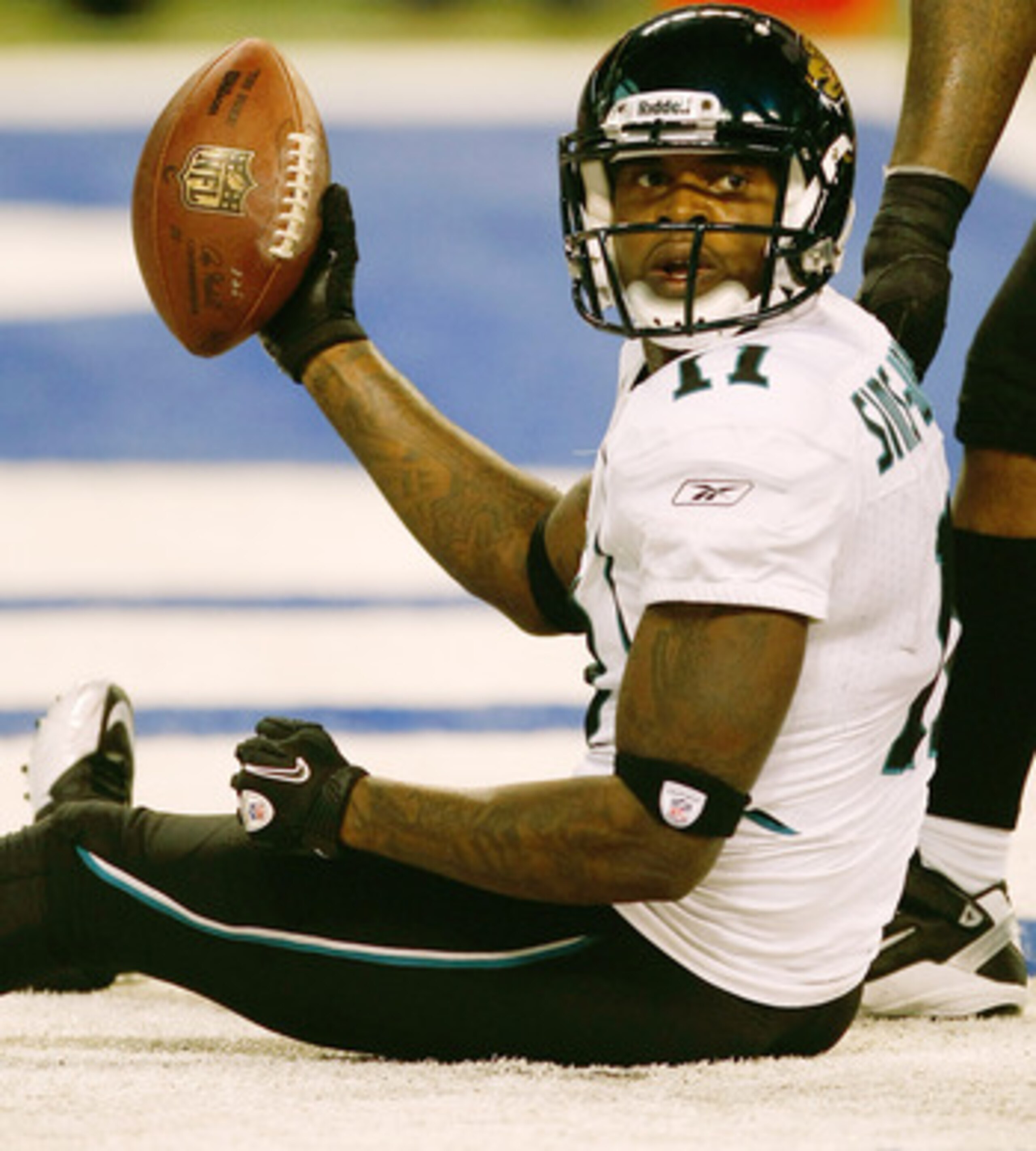 INDIANAPOLIS, IN - DECEMBER 19: Mike Sims-Walker #11 of the Jacksonville Jaguars holds up the football after scoring a touchdown against the Indianapolis Colts at Lucas Oil Stadium on December 19, 2010 in Indianapolis, Indiana. The Colts defeated the Jagu INDIANAPOLIS, IN - DECEMBER 19: Mike Sims-Walker #11 of the Jacksonville Jaguars holds up the football after scoring a touchdown against the Indianapolis Colts at Lucas Oil Stadium on December 19, 2010 in Indianapolis, Indiana. The Colts defeated the Jagu