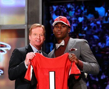 NEW YORK, NY - APRIL 28:  NFL Commissioner Roger Goodell (L) poses for a photo with Julio Jones, #6 overall pick by the Atlanta Falcons, holds up a jersey on stage during the 2011 NFL Draft at Radio City Music Hall on April 28, 2011 in New York City.  (Ph