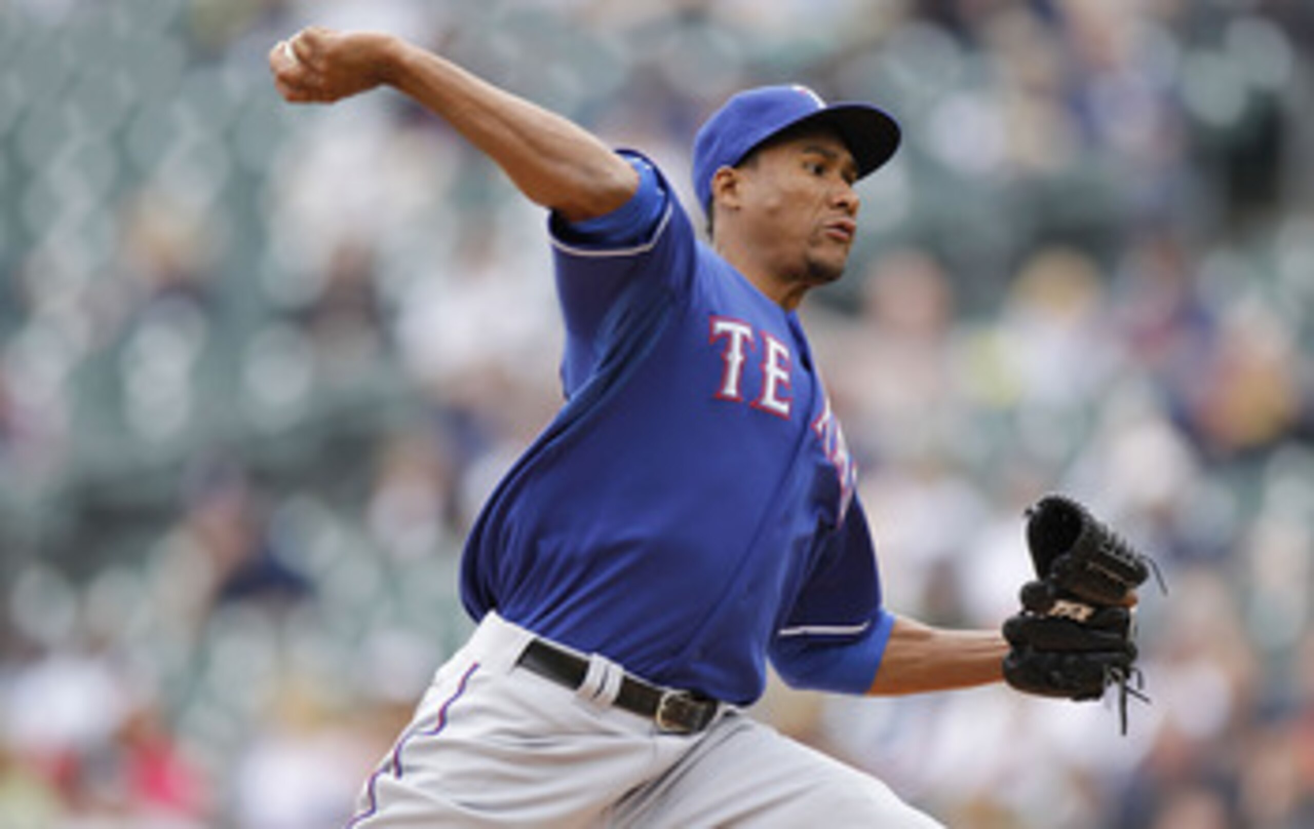 DETROIT, MI - APRIL 11:  Alexi Ogando #41 of the Texas Rangers throws a pitch while playing the Detroit Tigers at Comerica Park on April 11, 2011 in Detroit, Michigan.  (Photo by Gregory Shamus/Getty Images)