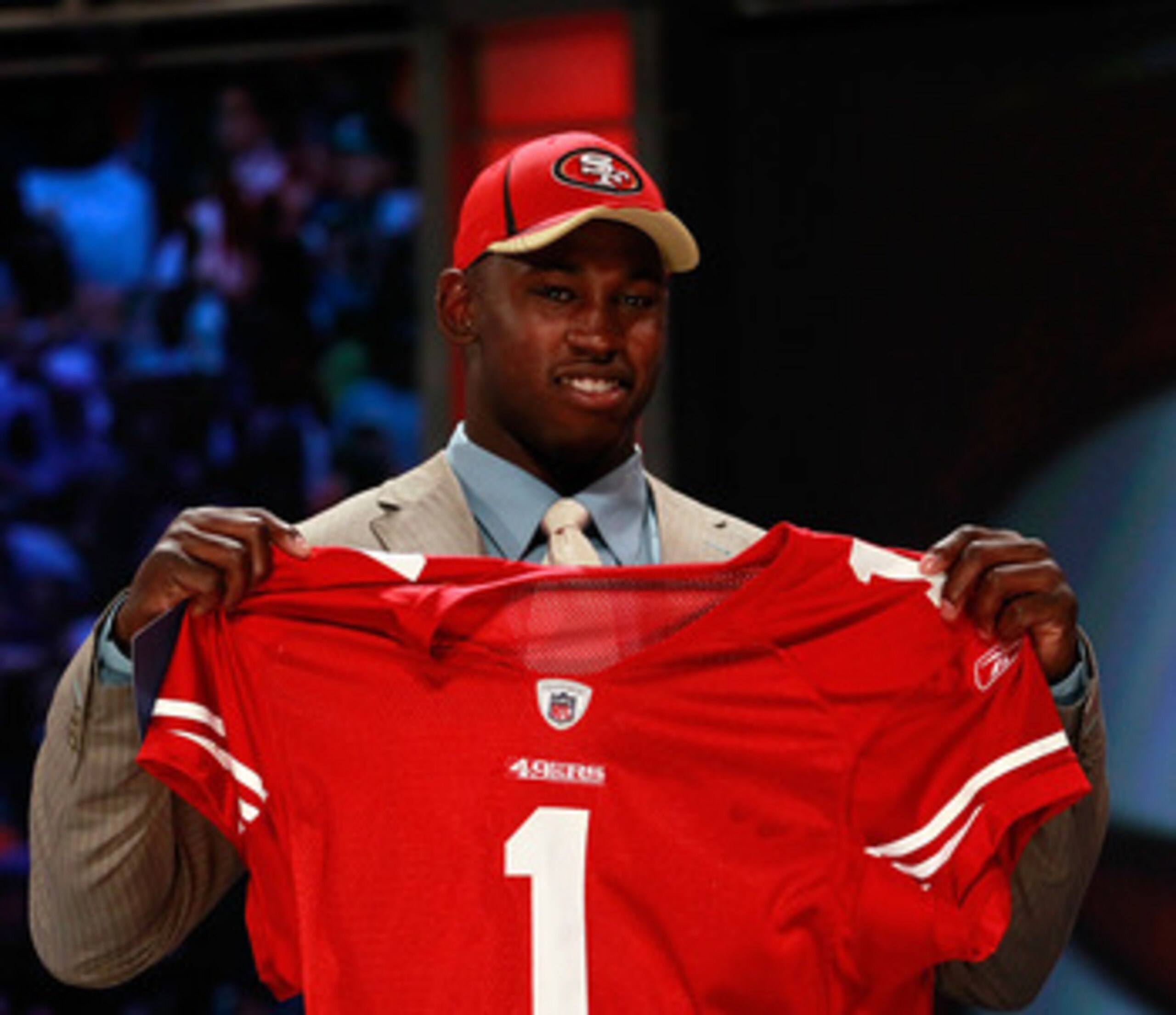 NEW YORK, NY - APRIL 28:  Aldon Smith, #7 overall pick by the San Francisco 49ers, holds up a jersey on stage during the 2011 NFL Draft at Radio City Music Hall on April 28, 2011 in New York City.  (Photo by Chris Trotman/Getty Images)