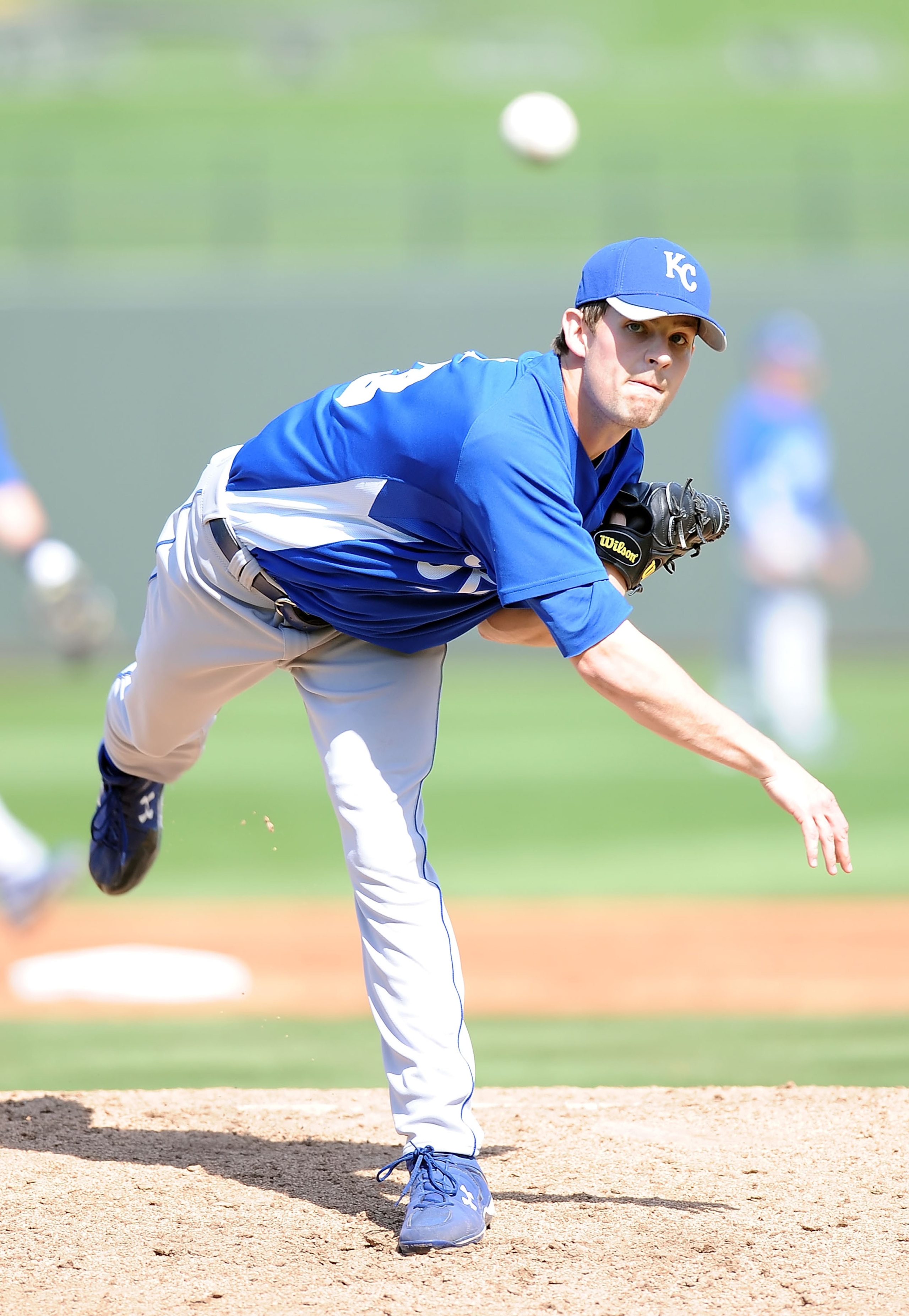 SURPRISE, AZ - MARCH 06:  Aaron Crow #43 of the Kansas City Royals pitches during a Spring Training game against the Texas Rangers on March 6, 2010 in Surprise, Arizona.  (Photo by Lisa Blumenfeld/Getty Images)