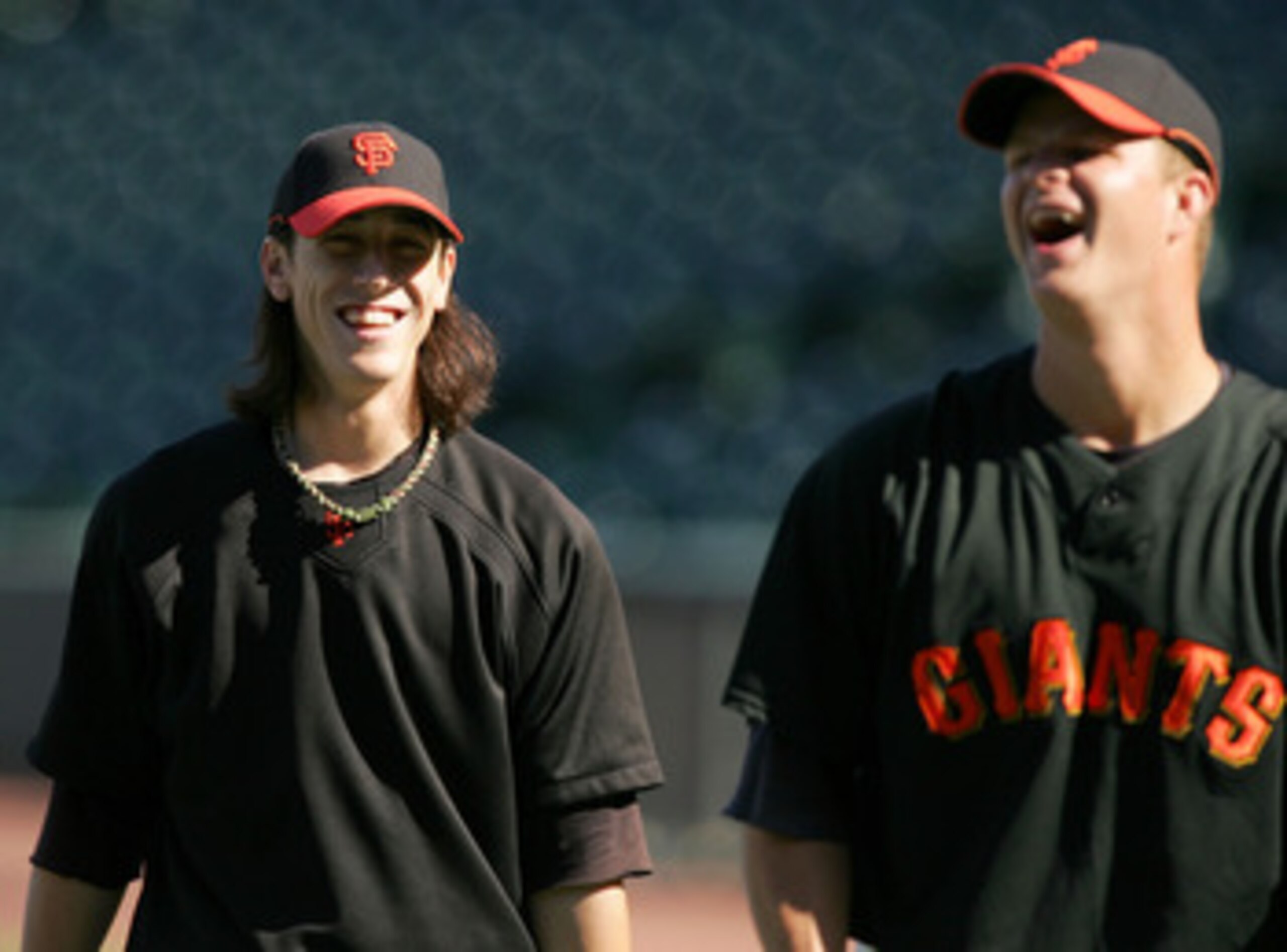 SAN FRANCISCO - AUGUST 26:  Tim Lincecum #55 of the San Francisco Giants jokes with Matt Cain #18 during batting practice before their game against the Arizona Diamondbacks at AT&T Park on August 26, 2009 in San Francisco, California.  (Photo by Ezra Shaw