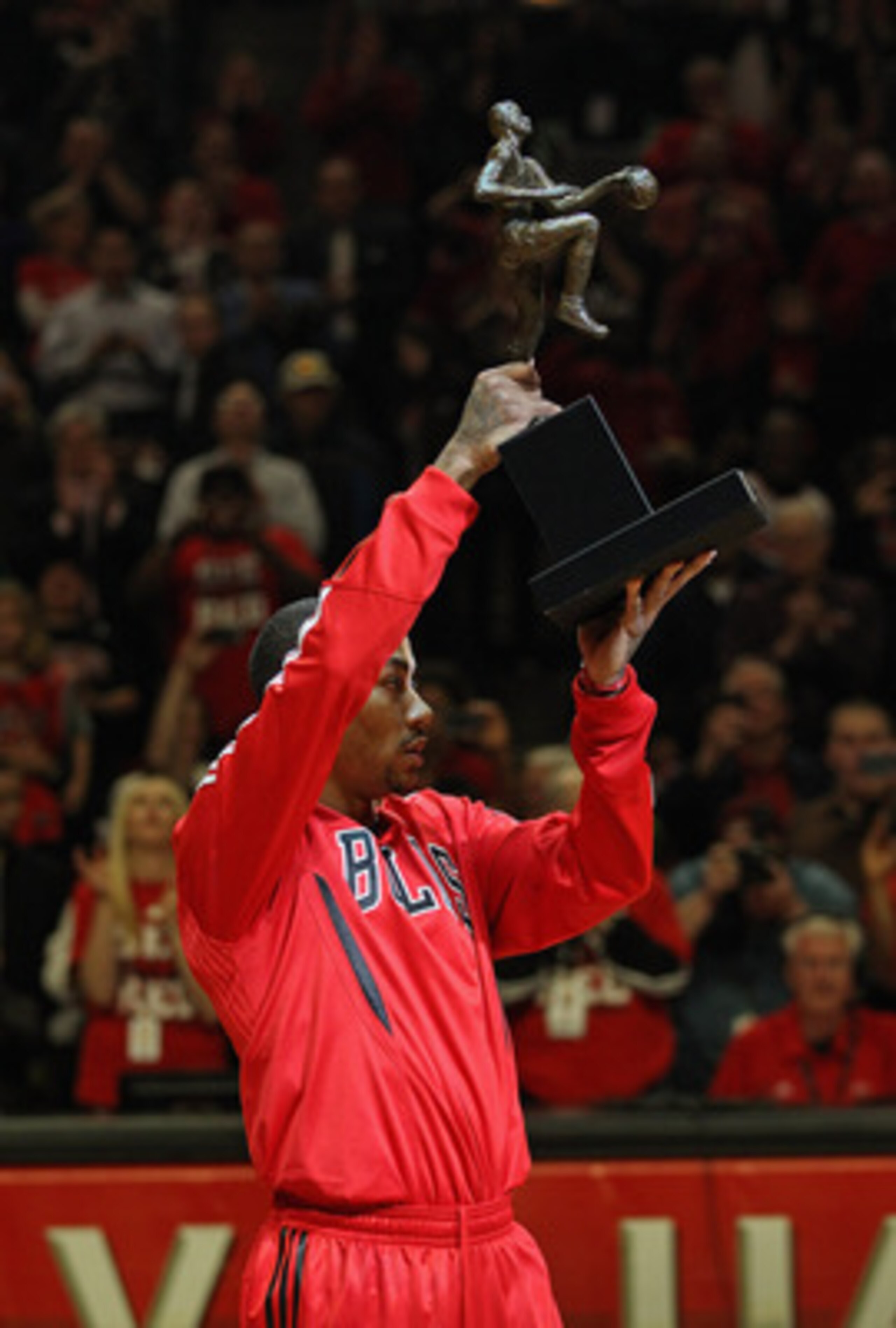 CHICAGO, IL - MAY 04: Derrick Rose #1 of the Chicago Bulls holds up the Maurice Podoloff Trophy awarded to the NBA Most Valuable Player before taking on the Atlanta Hawks in Game Two of the Eastern Conference Semifinals in the 2011 NBA Playoffs at the Uni