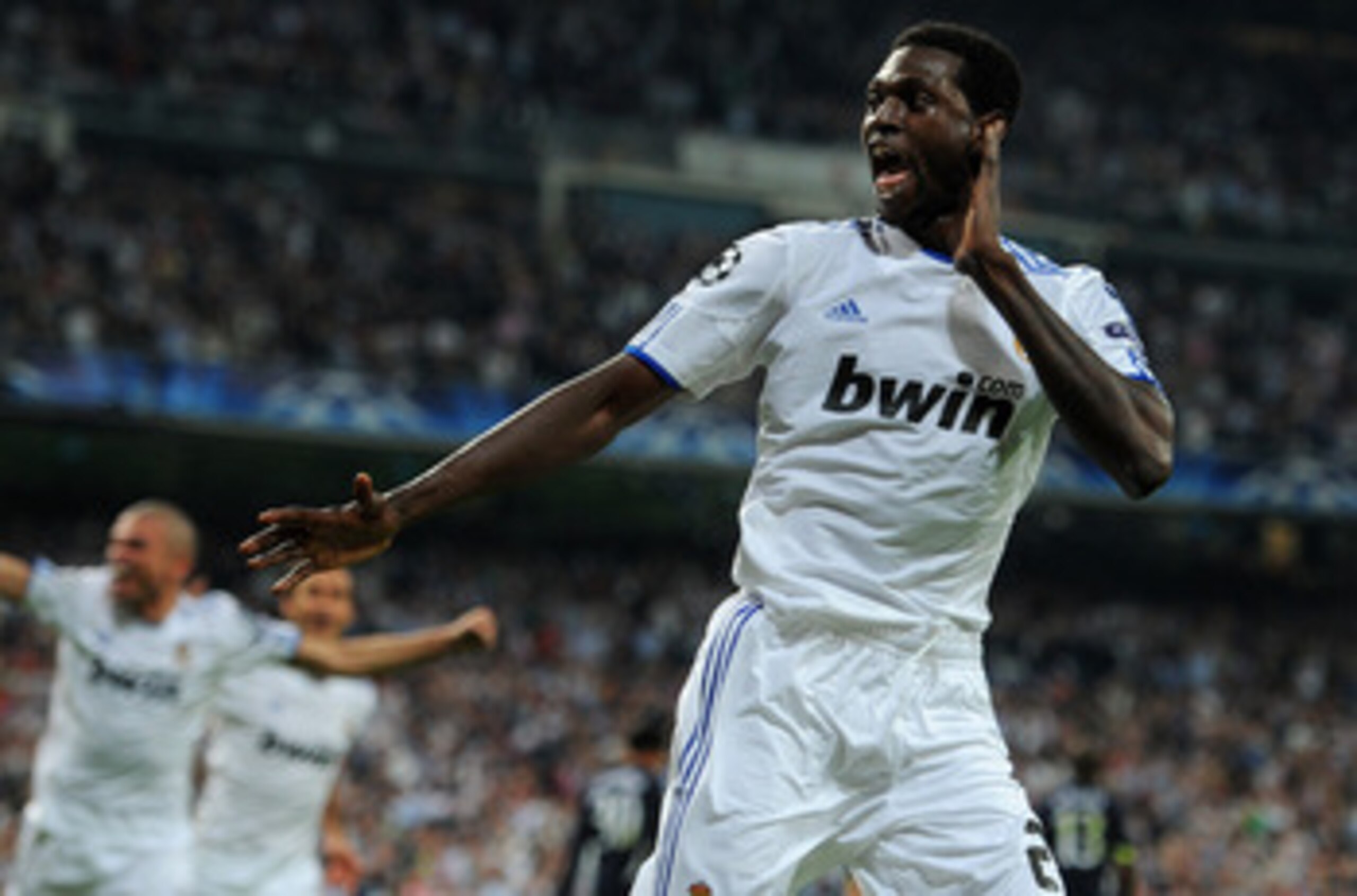 MADRID, SPAIN - APRIL 05:  Emmanuel Adebayor of Real Madrid celebrates scoring his second goal during the UEFA Champions League quarter final first leg match between Real Madrid and Tottenham Hotspur at Estadio Santiago Bernabeu on April 5, 2011 in Madrid