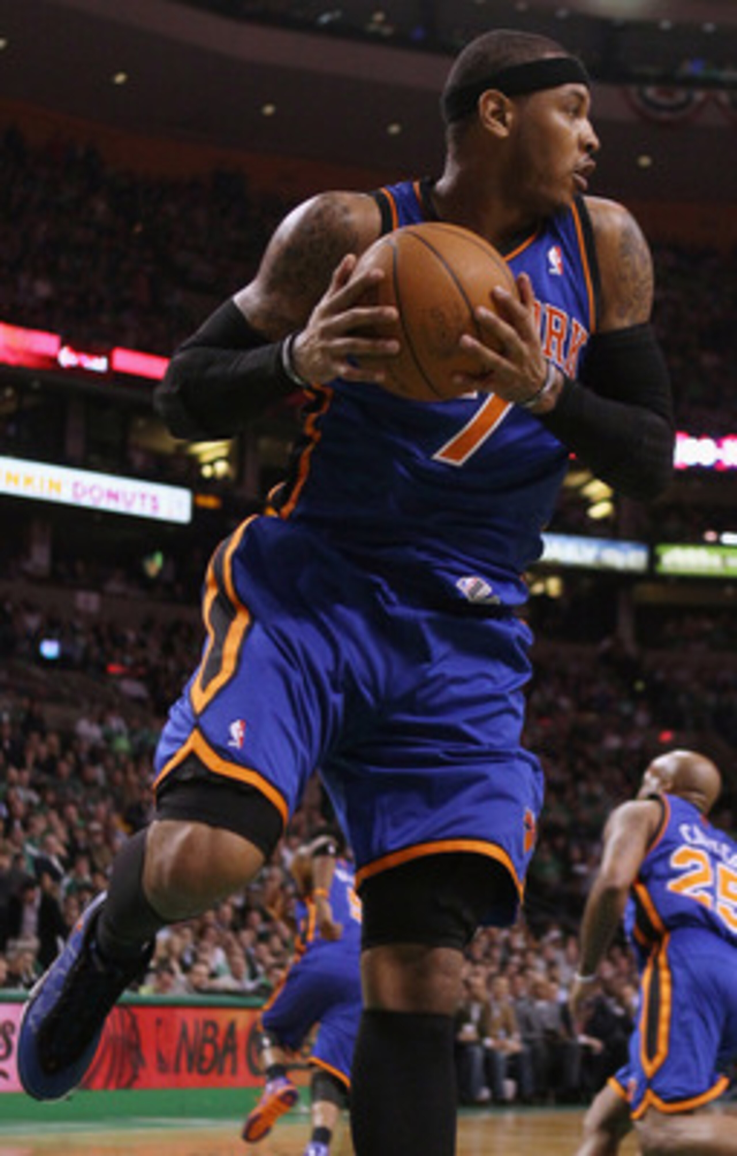 BOSTON, MA - APRIL 19:  Carmelo Anthony #7 of the New York Knicks grabs the rebound in the first quarter against the Boston Celtics in Game Two of the Eastern Conference Quarterfinals in the 2011 NBA Playoffs on April 19, 2011 at the TD Garden in Boston,