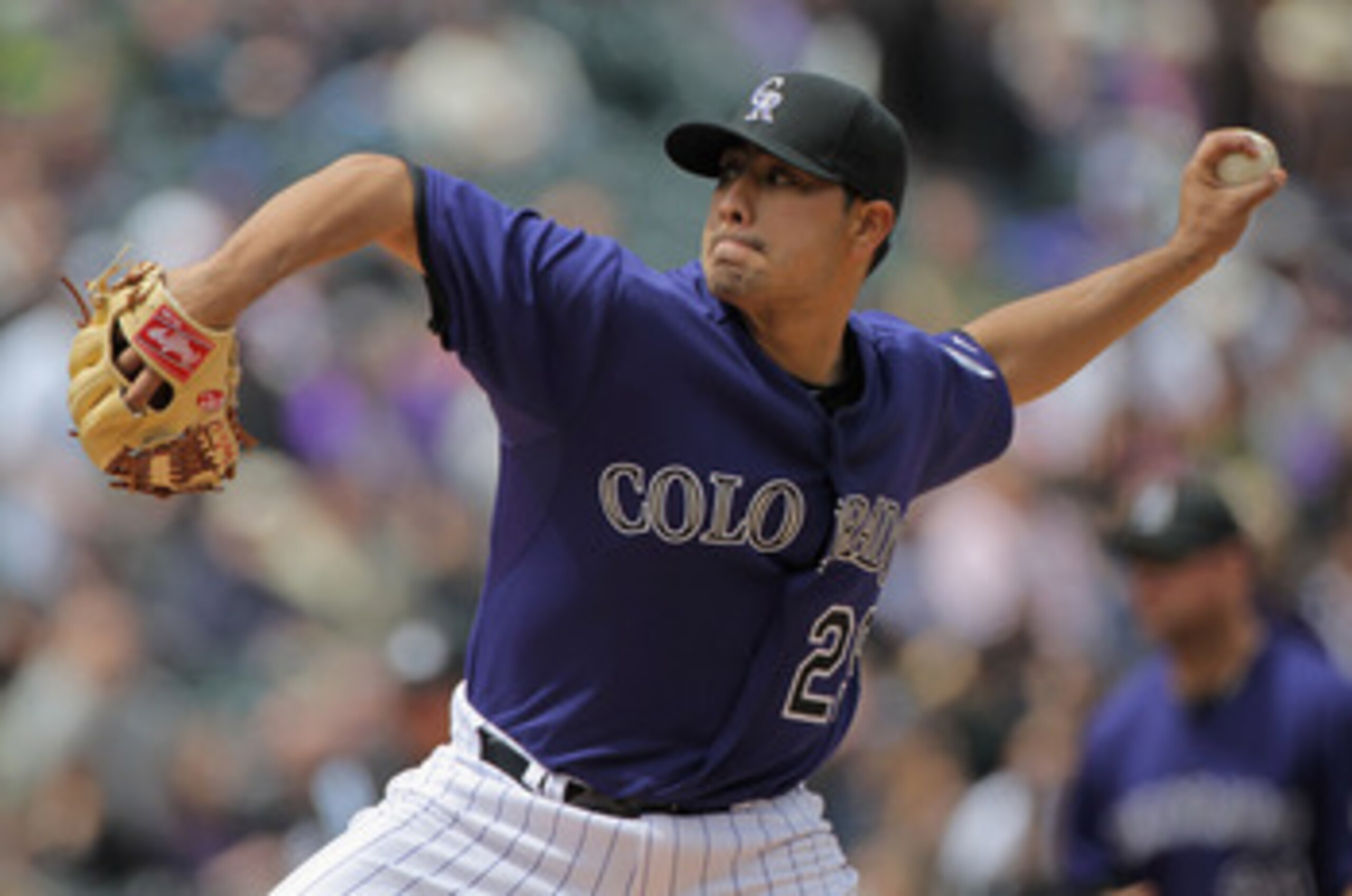 DENVER, CO - APRIL 20:  Starting pitcher Jorge De La Rosa #29 of the Colorado Rockies delivers against the San Francisco Giants at Coors Field on April 20, 2011 in Denver, Colorado.  (Photo by Doug Pensinger/Getty Images)