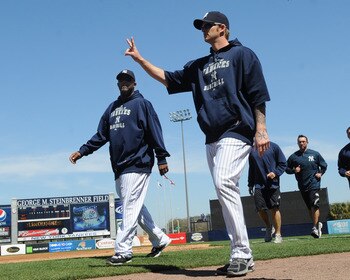 TAMPA, FL - MARCH 5: Pitchers A. J. Burnett #34 and CC Sabathia  #52 of the New York Yankees walk to the dugout before play  against the Tampa Bay Rays March 5, 2010 at the George M. Steinbrenner  Field in Tampa, Florida. (Photo by Al Messerschmidt/Getty