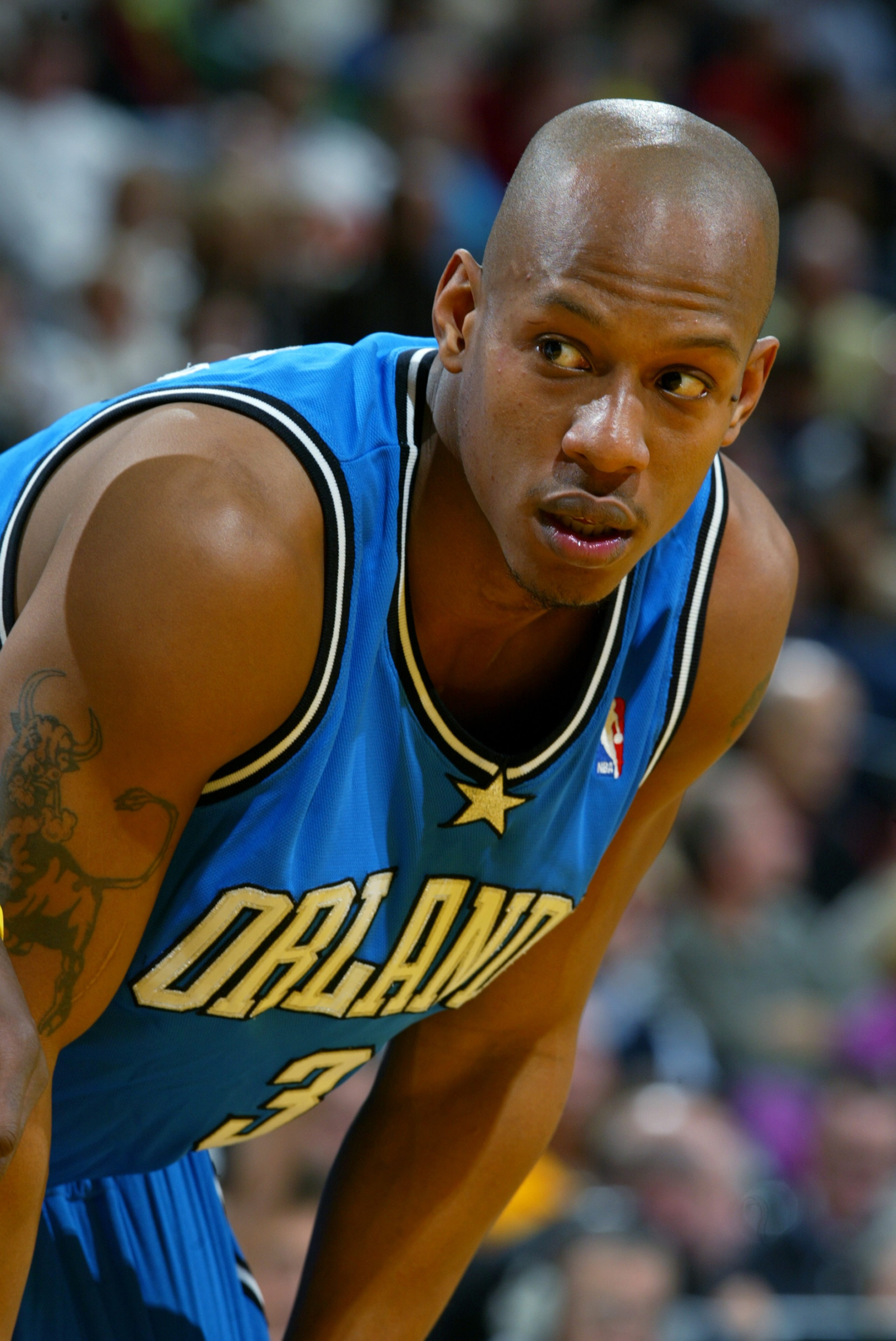 INDIANAPOLIS - DECEMBER 17: Keith Bogans #3 of the Orlando Magic leans over during the game against the Indiana Pacers on December 17, 2003 at Conseco Fieldhouse in Indianapolis, Indiana. The Magic won 94-90. NOTE TO USER: User expressly acknowledges a INDIANAPOLIS - DECEMBER 17: Keith Bogans #3 of the Orlando Magic leans over during the game against the Indiana Pacers on December 17, 2003 at Conseco Fieldhouse in Indianapolis, Indiana. The Magic won 94-90. NOTE TO USER: User expressly acknowledges a