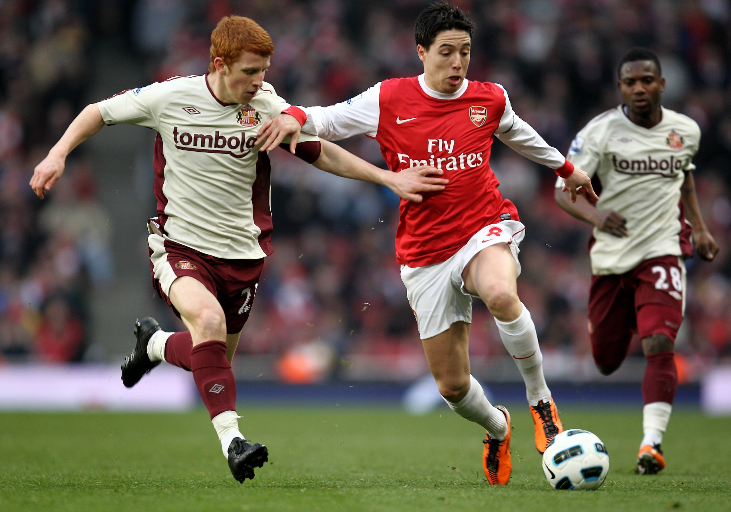 LONDON, ENGLAND - MARCH 05:  Jack Colback of Sunderland and Samir Nasri of Arsenal fight for the ball during the Barclays Premier League match between Arsenal and Sunderland at Emirates Stadium on March 5, 2011 in London, England.  (Photo by Paul Gilham/G