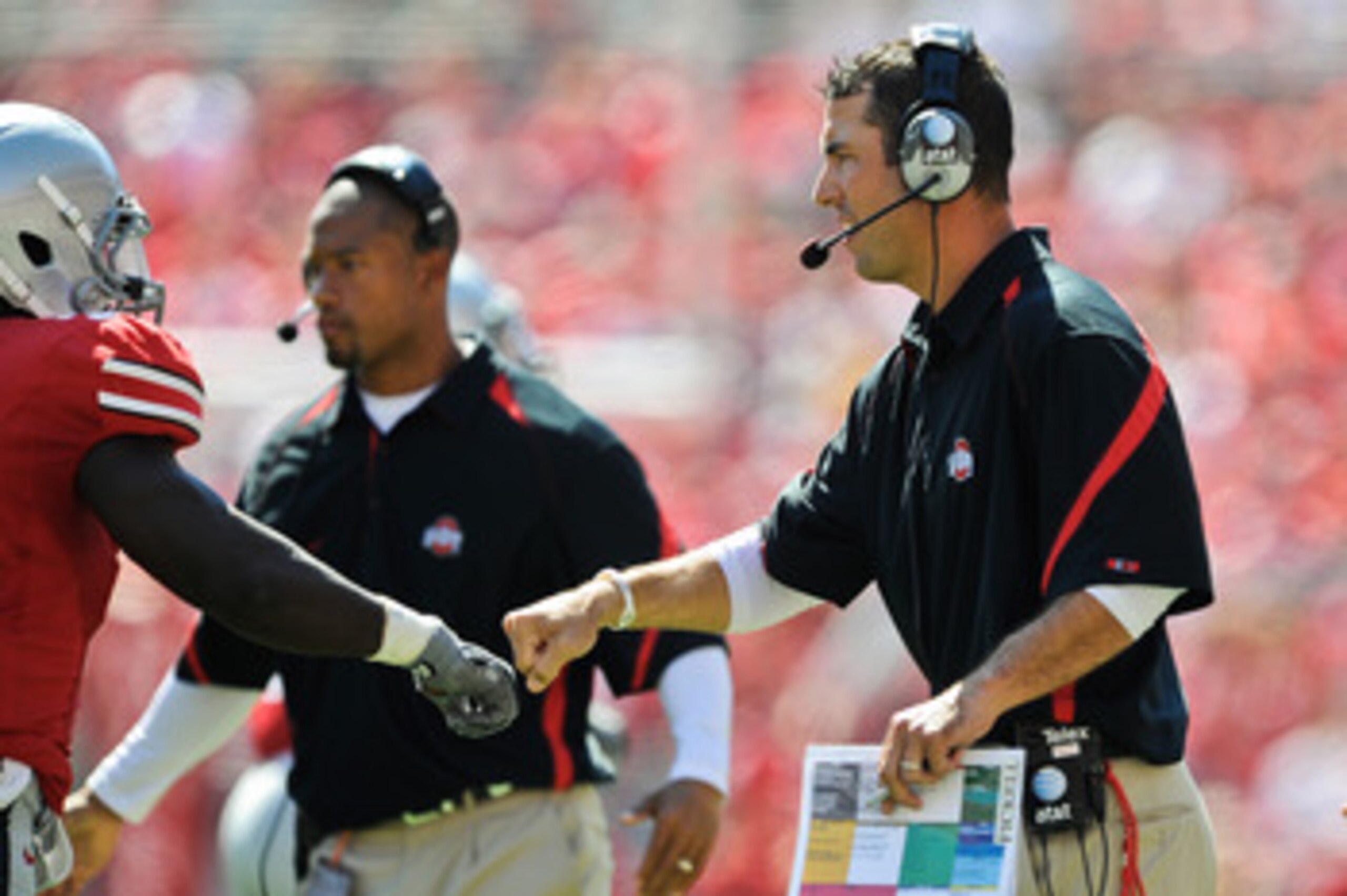 COLUMBUS, OH - SEPTEMBER 18: Assistant Coach Luke Fickell of the Ohio State Buckeyes fists pump one of his players during a game against the Ohio Bobcats at Ohio Stadium on September 18, 2010 in Columbus, Ohio. (Photo by Jamie Sabau/Getty Images) COLUMBUS, OH - SEPTEMBER 18: Assistant Coach Luke Fickell of the Ohio State Buckeyes fists pump one of his players during a game against the Ohio Bobcats at Ohio Stadium on September 18, 2010 in Columbus, Ohio. (Photo by Jamie Sabau/Getty Images)
