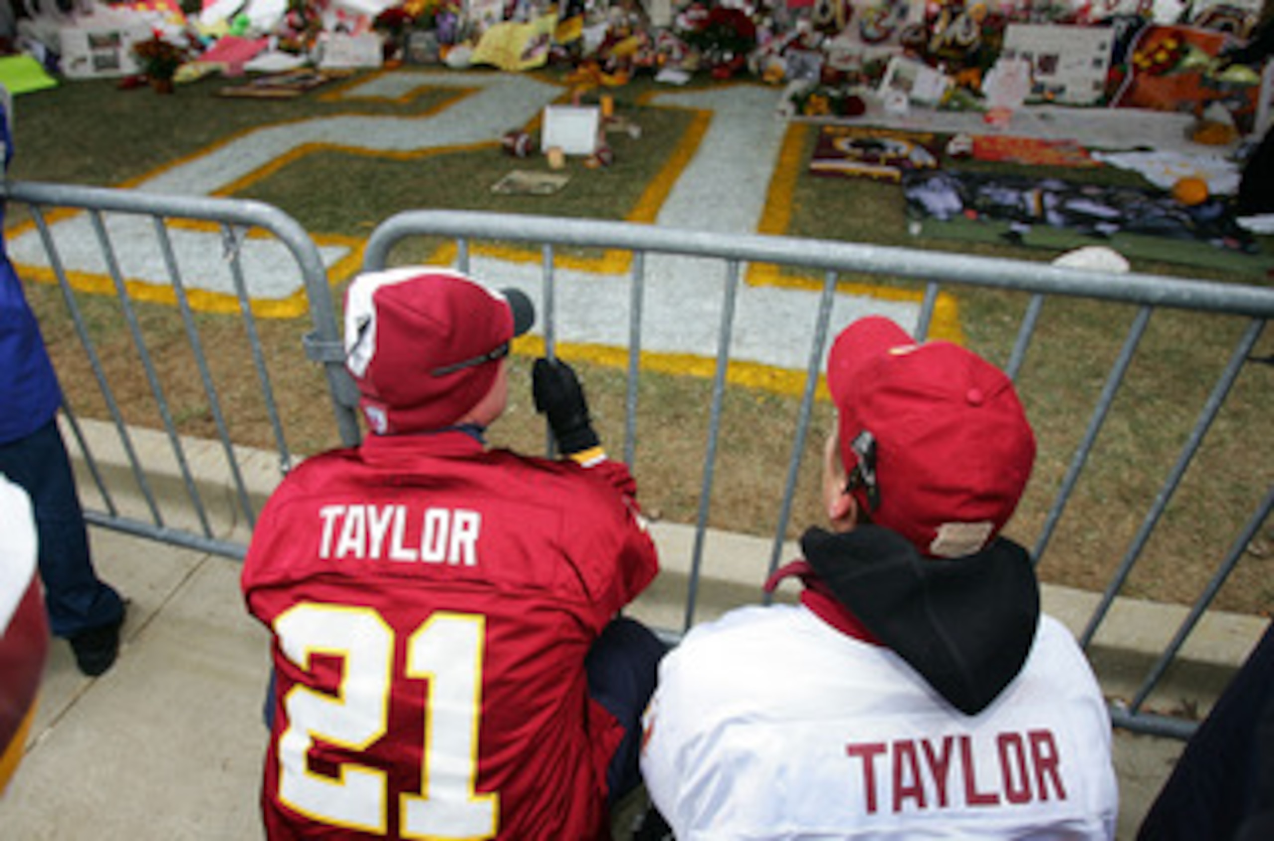 LANDOVER, MD - DECEMBER 02:  Fans of the Washington Redskins pay thier respects at the memorial for the late Sean Taylor before the game against the Buffalo Bills on December 2, 2007 at FedEx Field in Landover, Maryland. Taylor died November 27, a day aft